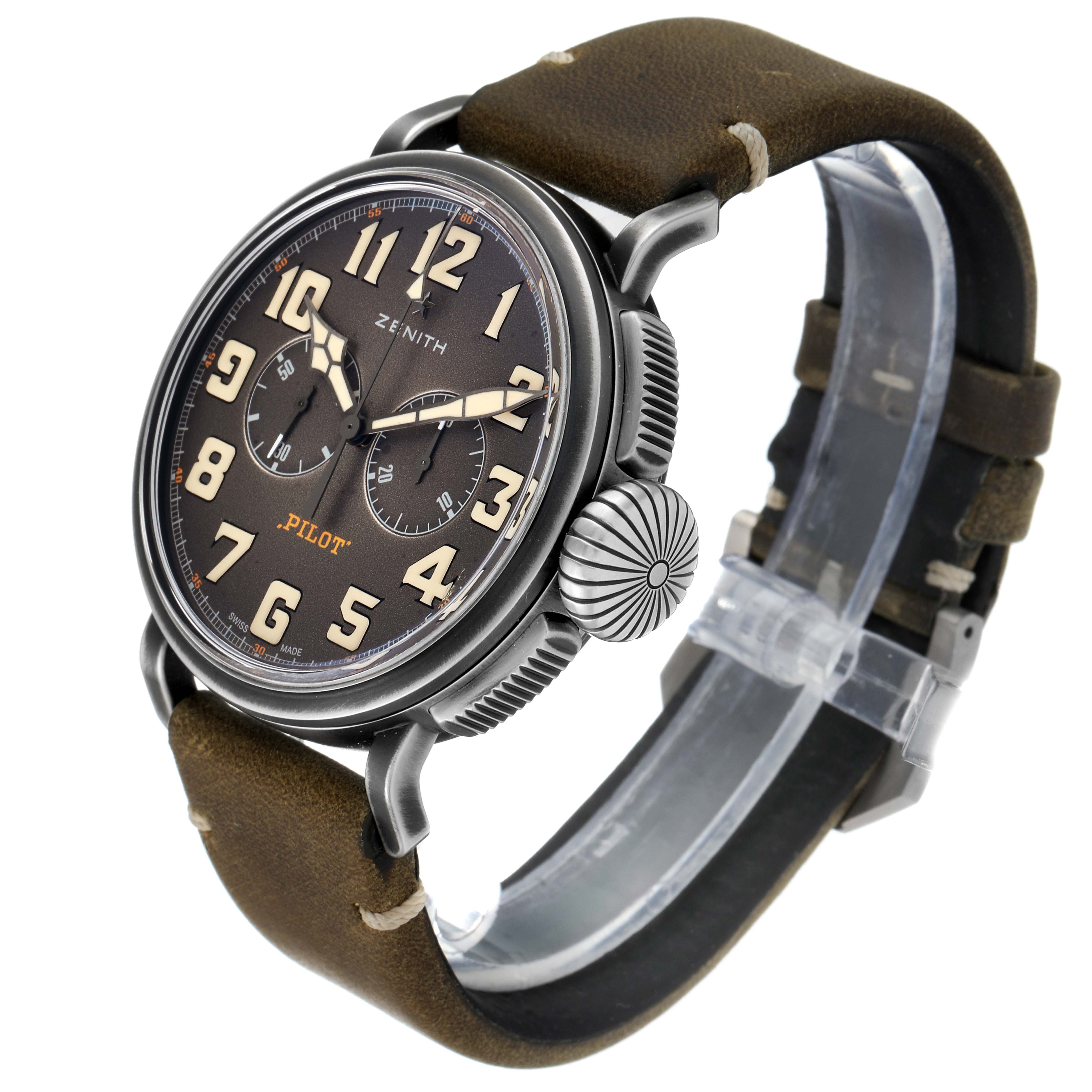 The image shows a side angle view of the Zenith Pilot 11.2430.4069/21.C773 Men's Stainless Steel Grey Dial 11.2430.4069/21.C773 Men's Stainless Steel Grey Dial model watch, highlighting its face, oversized crown, and leather strap.