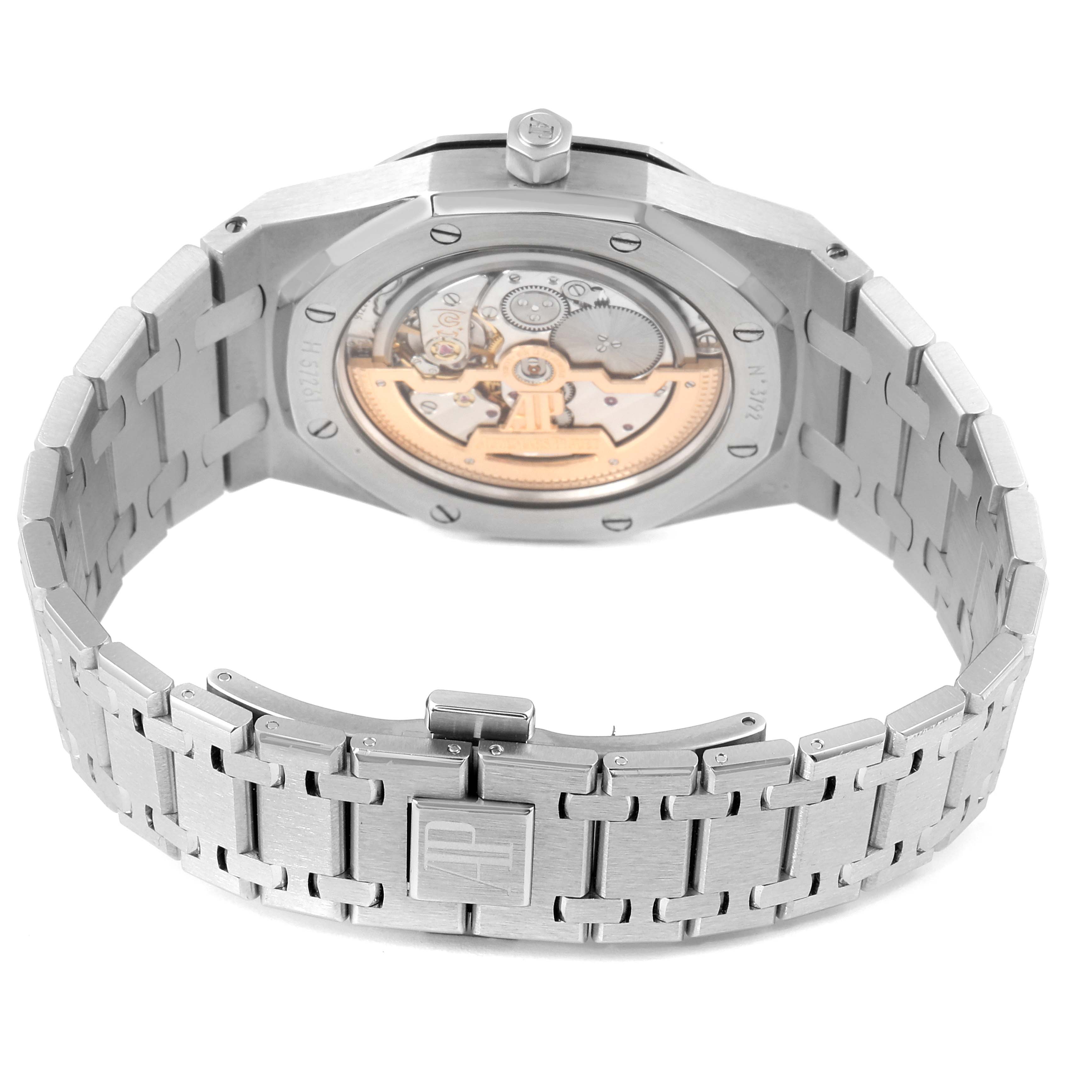 The image shows the back view of an Audemars Piguet Royal Oak 15202ST.OO.1240ST.01 Men's Stainless Steel Blue Dial 15202ST.OO.1240ST.01 Men's Stainless Steel Blue Dial watch, highlighting its exposed mechanical movement and bracelet.