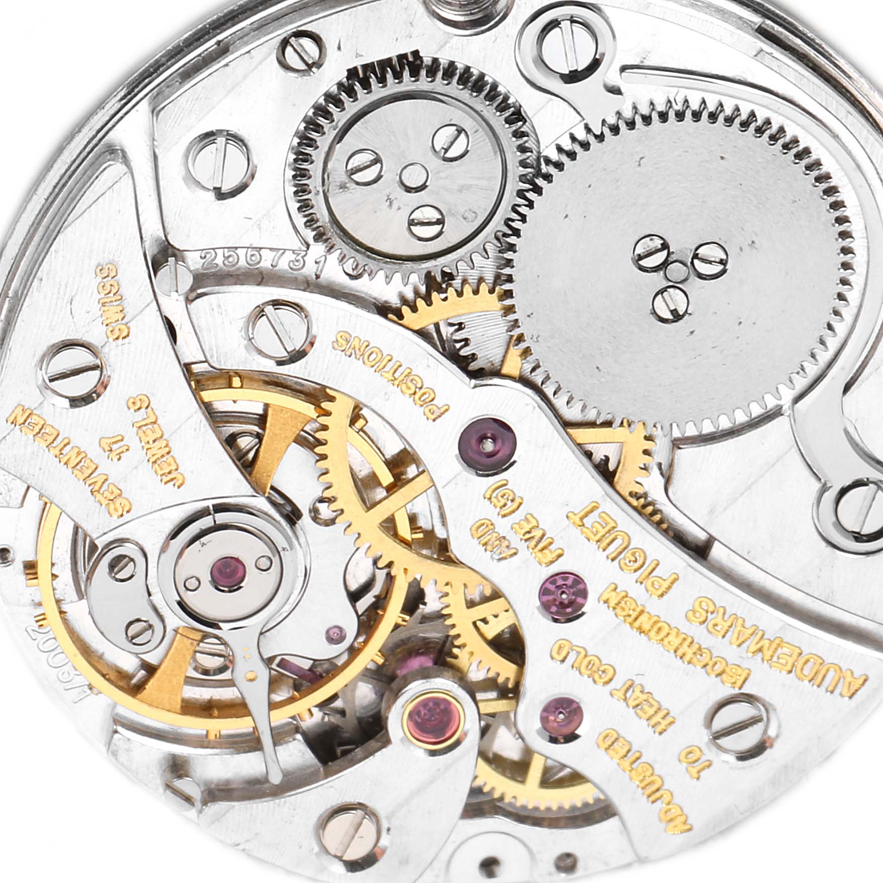 This image shows a close-up view of the inner mechanical movement of a Vintage Audemars Piguet watch, highlighting gears and components.