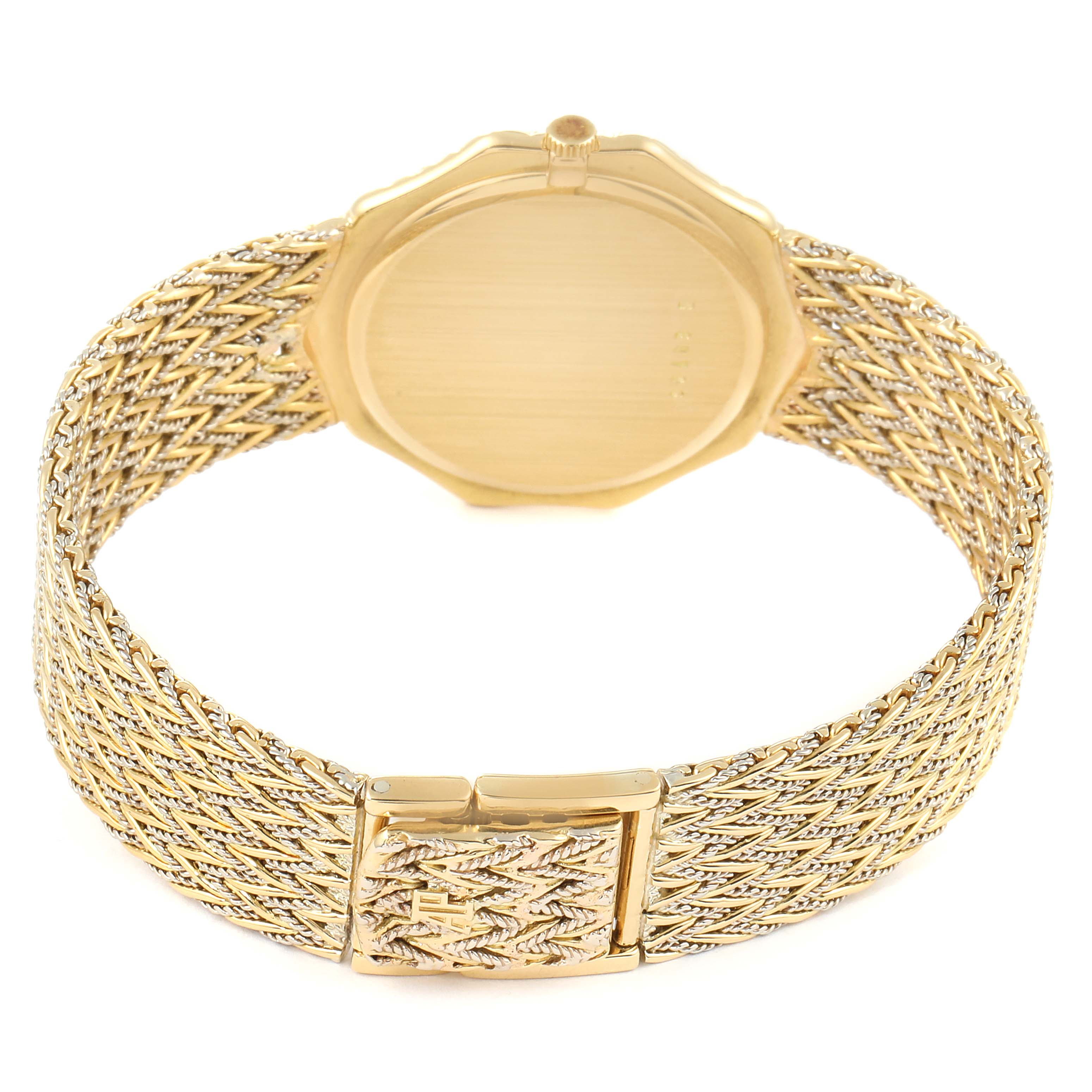 This image shows the back view of a Vintage Audemars Piguet watch, highlighting its gold case and intricately woven bracelet.