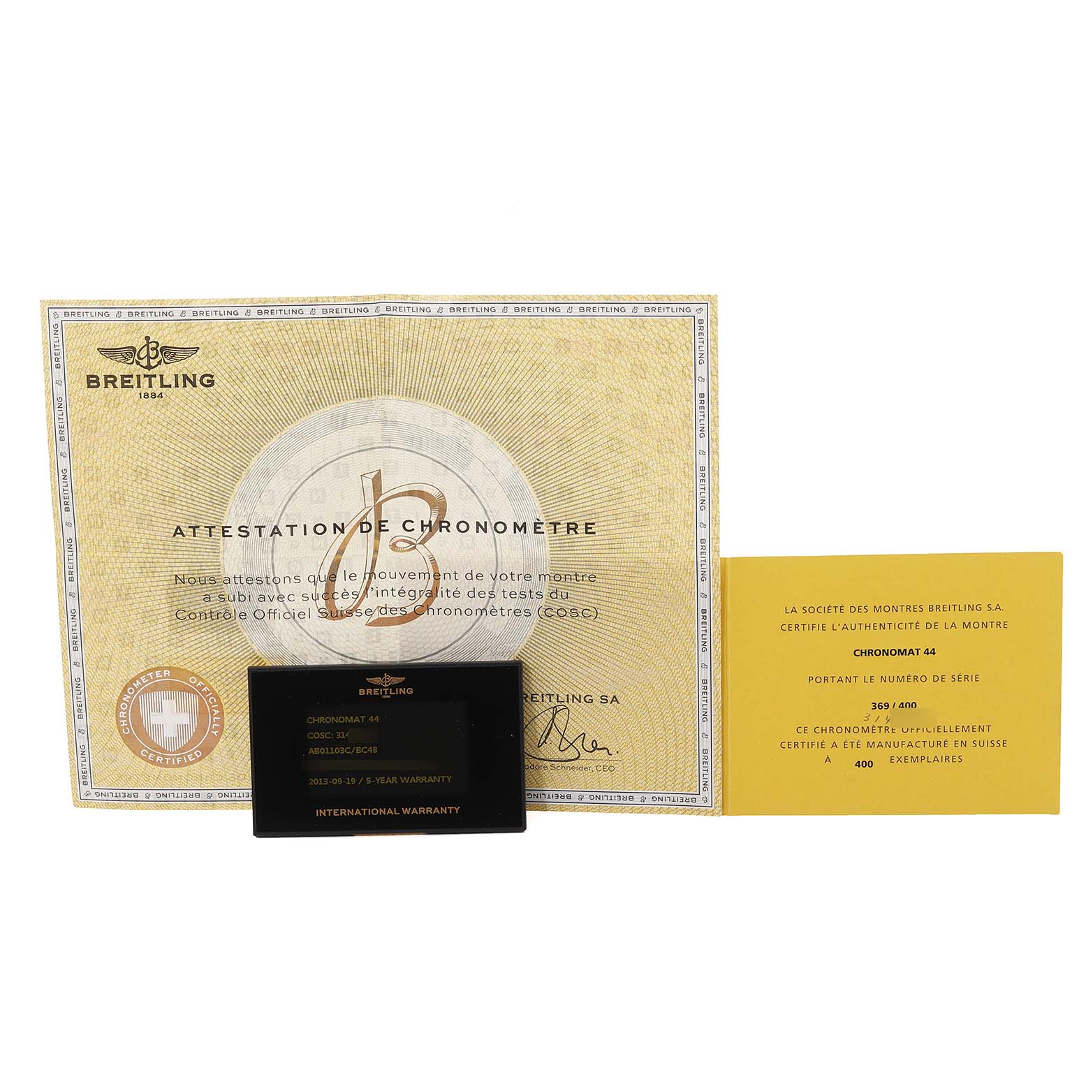 The image shows the warranty and authenticity certificates for a Breitling Chronomat AB01103C/BC48 Men's Stainless Steel Mother of Pearl Dial AB01103C/BC48 Men's Stainless Steel Mother of Pearl Dial watch, displayed from a front angle.