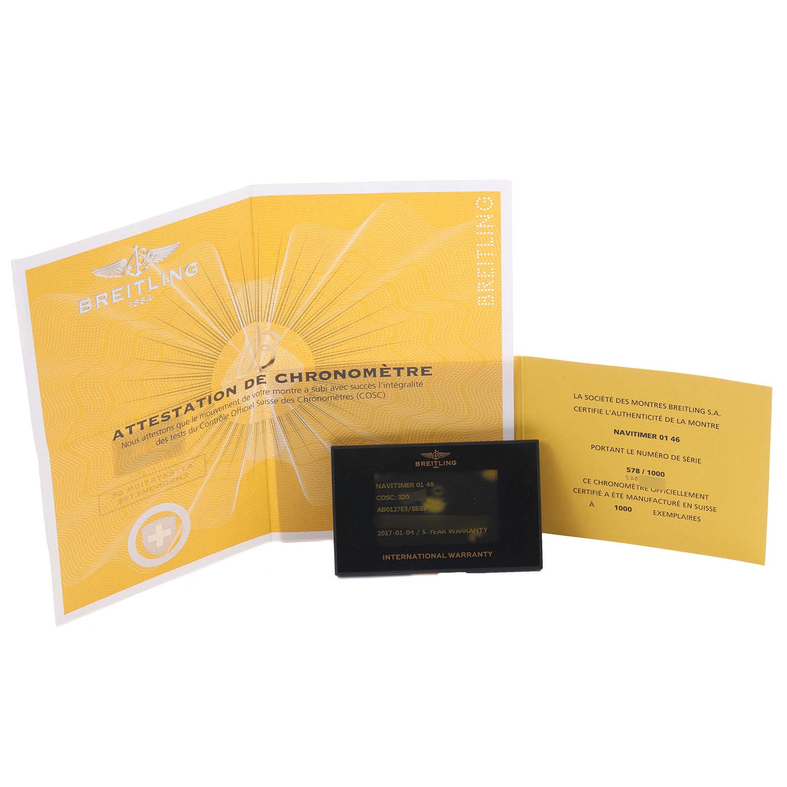 The image shows Breitling Navitimer AB0127E3/BE81 Men's Stainless Steel Black Dial AB0127E3/BE81 Men's Stainless Steel Black Dial documents, including a chronometer certificate and warranty card, presented upright.