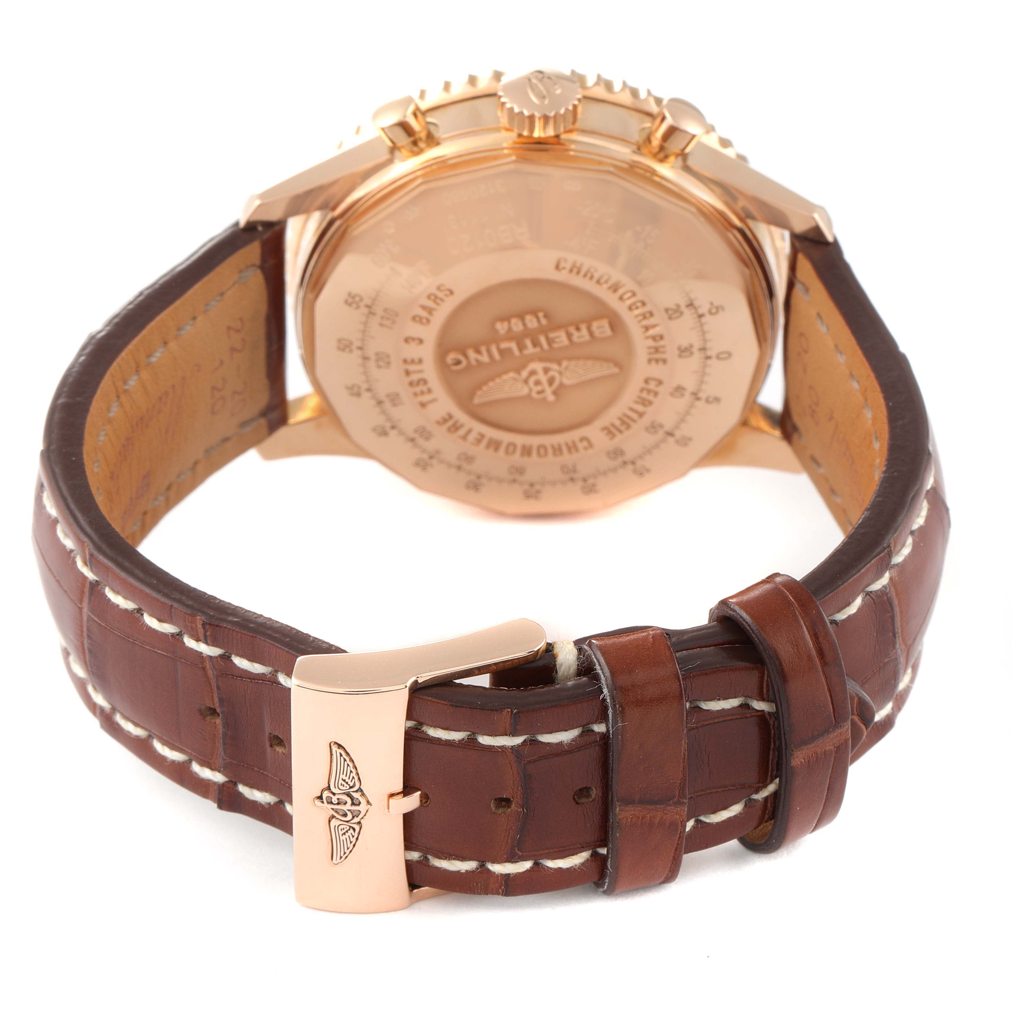 The image shows the back and strap of a Breitling Navitimer RB0120 Men's Rose Gold Black Dial RB0120 Men's Rose Gold Black Dial watch, focusing on the case back and leather strap with clasp.