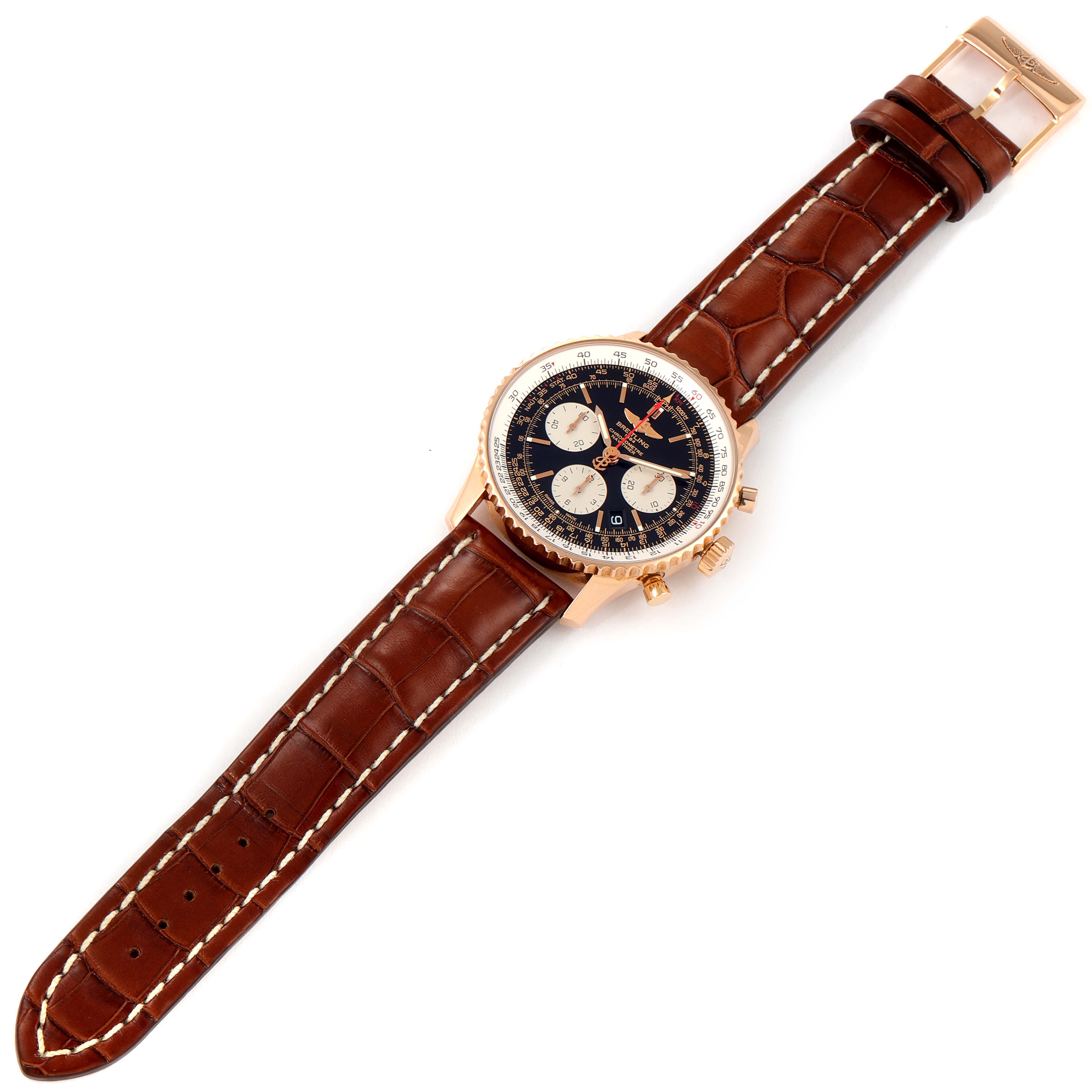 The Breitling Navitimer RB0120 Men's Rose Gold Black Dial RB0120 Men's Rose Gold Black Dial watch is shown from a top-down angle highlighting its dial, bezel, pushers, and leather strap.