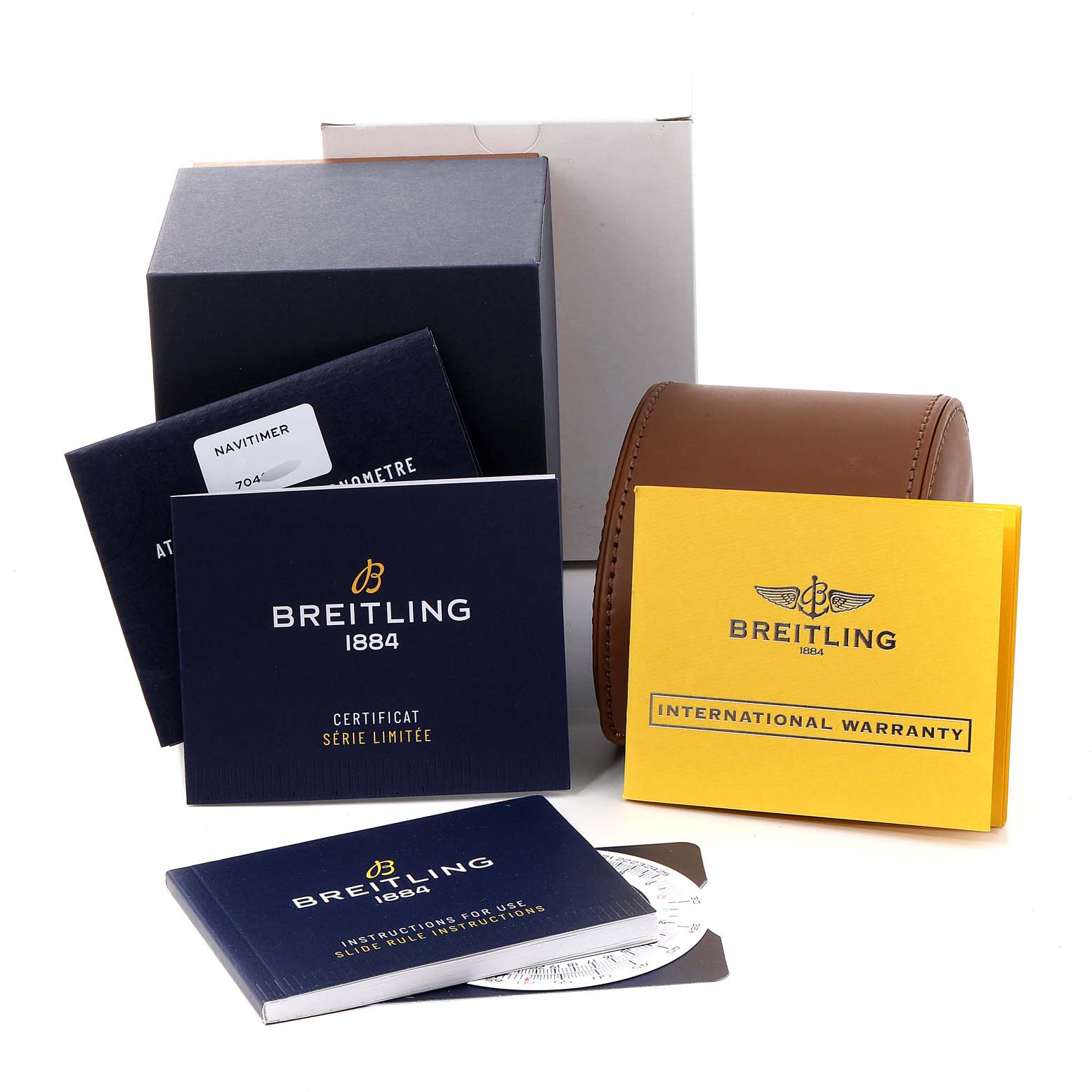 The image shows Breitling Navitimer U17326 Men
s Steel and Gold (two tone) Grey Dial U17326 Men
s Steel and Gold (two tone) Grey Dial watch packaging, including manuals, warranty cards, and a leather watch case, from an overhead angle.
