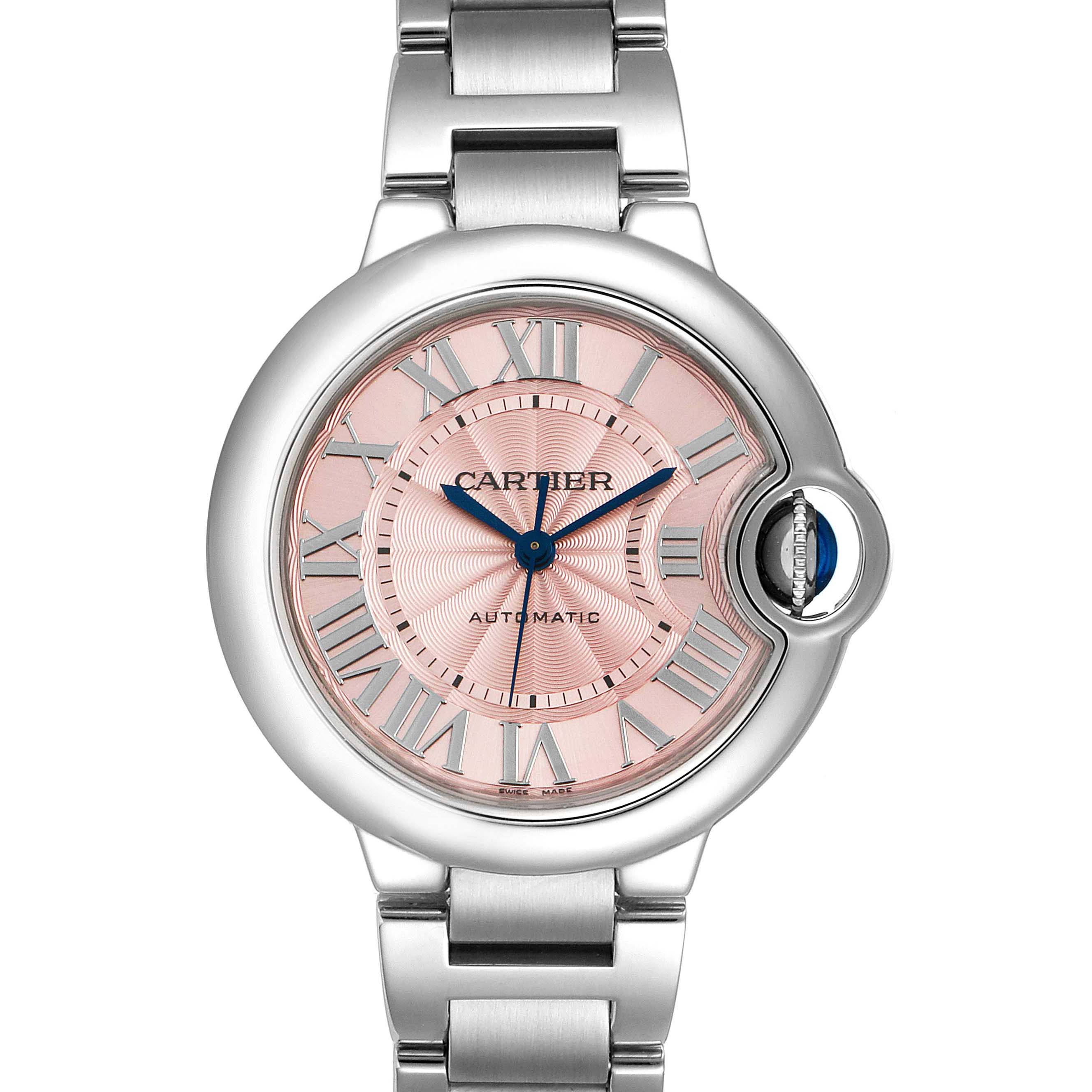 The image shows a full front view of the Cartier Ballon Bleu W6920100 Women
s Stainless Steel Pink Dial W6920100 Women
s Stainless Steel Pink Dial watch, highlighting its dial, crown, and bracelet.