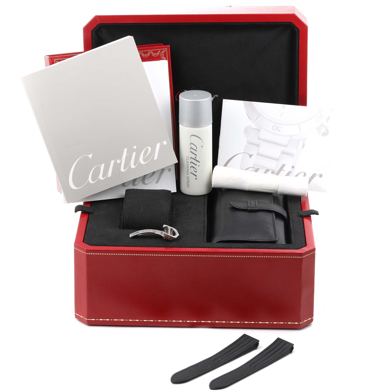 This image shows a Cartier Roadster W62020X6 Men
s Stainless Steel Black Dial W62020X6 Men
s Stainless Steel Black Dial watch set viewed from the front, featuring documentation, a cleaning kit, strap, and additional accessories in a red box.
