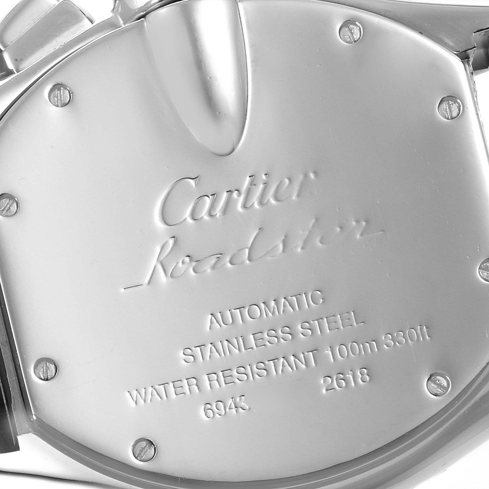 This image shows the case back of a Cartier Roadster W62019X6 Men
s Stainless Steel Silver Dial W62019X6 Men
s Stainless Steel Silver Dial watch, highlighting its engravings and screws.