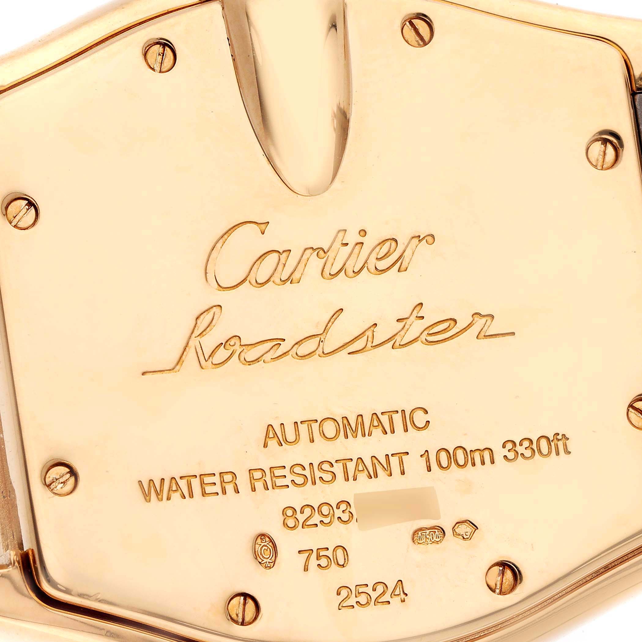 The image shows the back of a Cartier Roadster W62003V2 Men's Yellow Gold Silver Dial W62003V2 Men's Yellow Gold Silver Dial watch, highlighting its engravings and four screws.