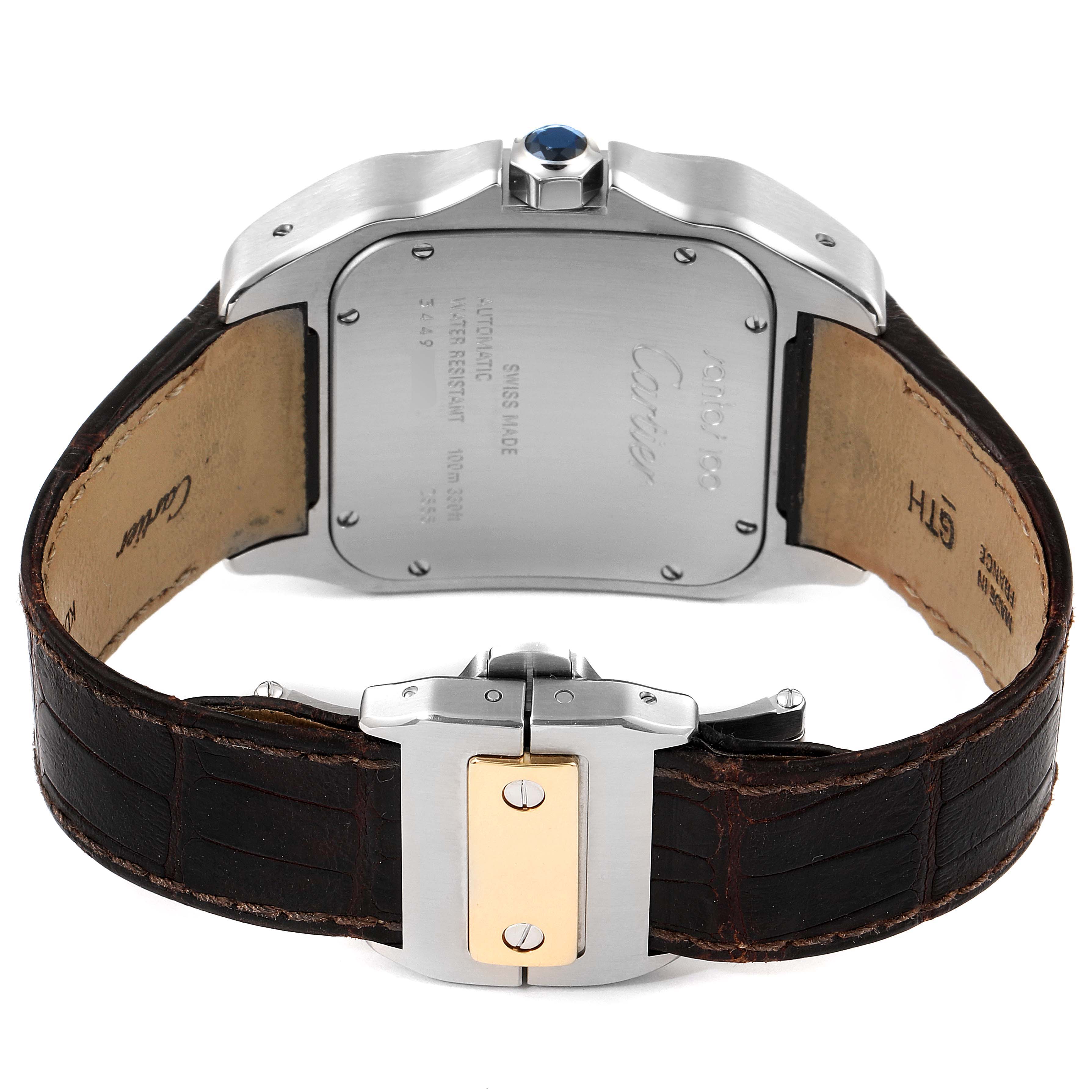 The image shows the back side of a Cartier Santos W20072X7 Men's Steel and Gold (two tone) Silver Dial W20072X7 Men's Steel and Gold (two tone) Silver Dial watch with its leather strap and clasp.