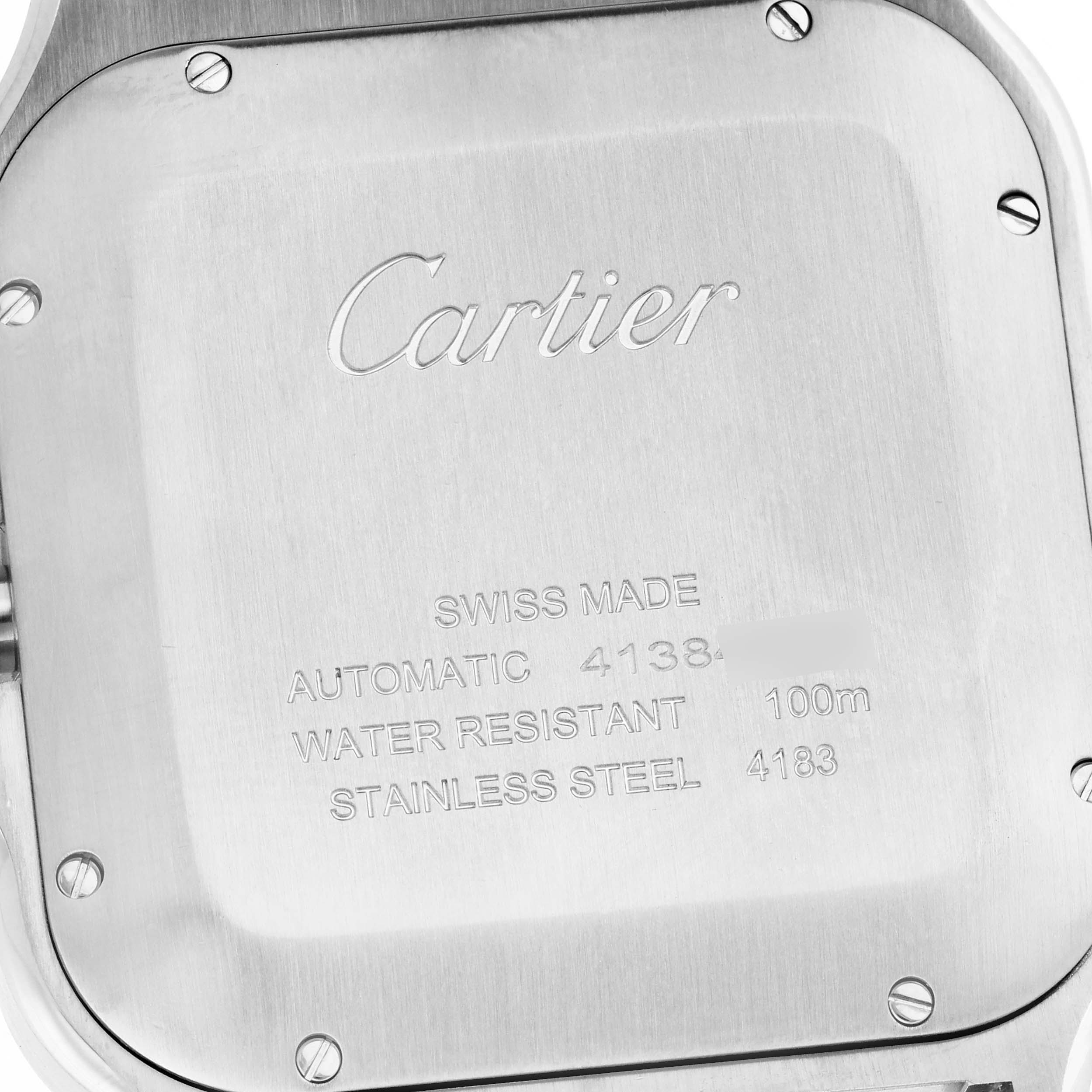 The image shows the backplate of a Cartier Santos WSSA0017 Men's Stainless Steel Silver Dial WSSA0017 Men's Stainless Steel Silver Dial watch, highlighting engraving details and screws.