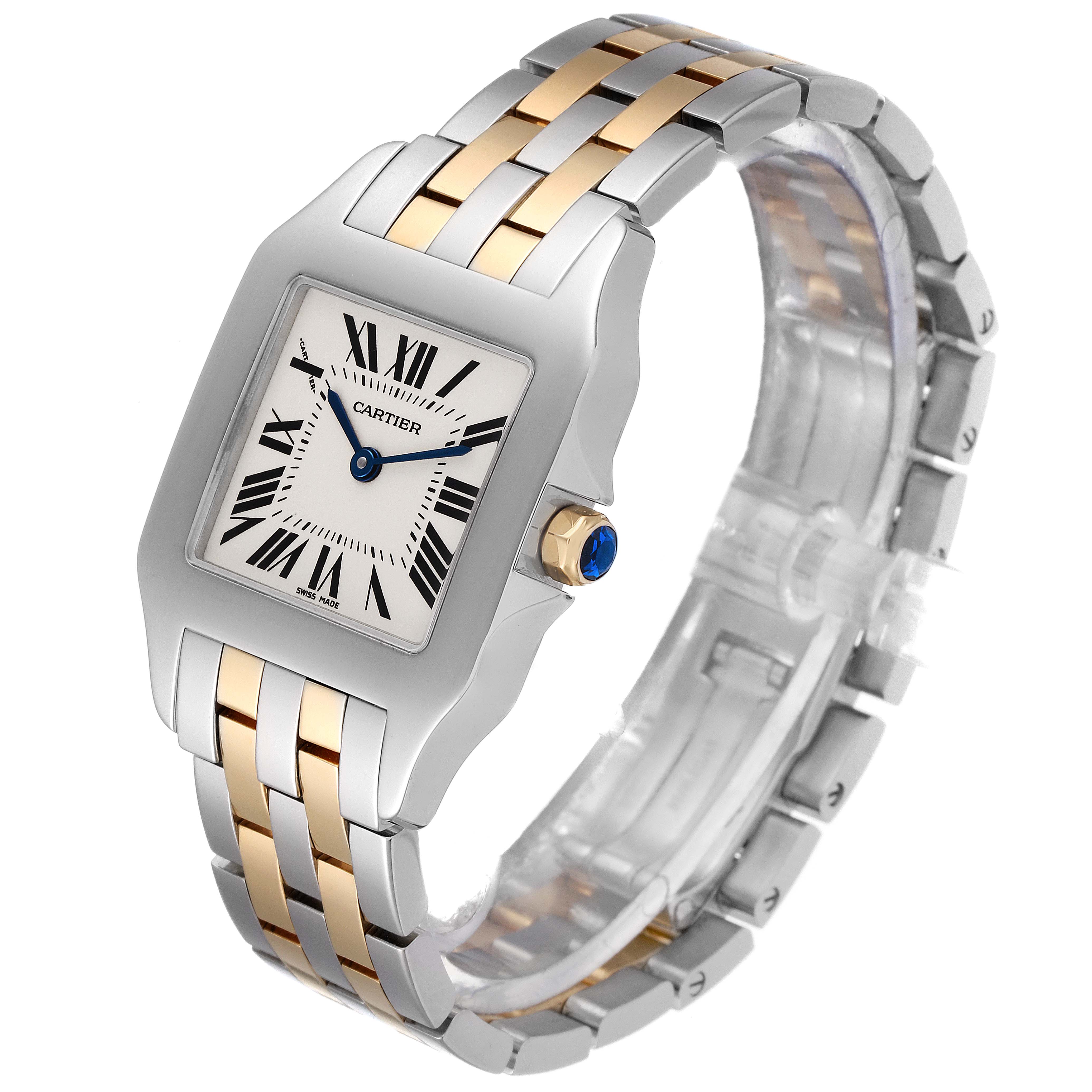 This Cartier Santos W25067Z6 Men
s Steel and Gold (two tone) Silver Dial W25067Z6 Men
s Steel and Gold (two tone) Silver Dial watch is shown at a side angle, highlighting its bezel, crown, and two-tone metal strap.