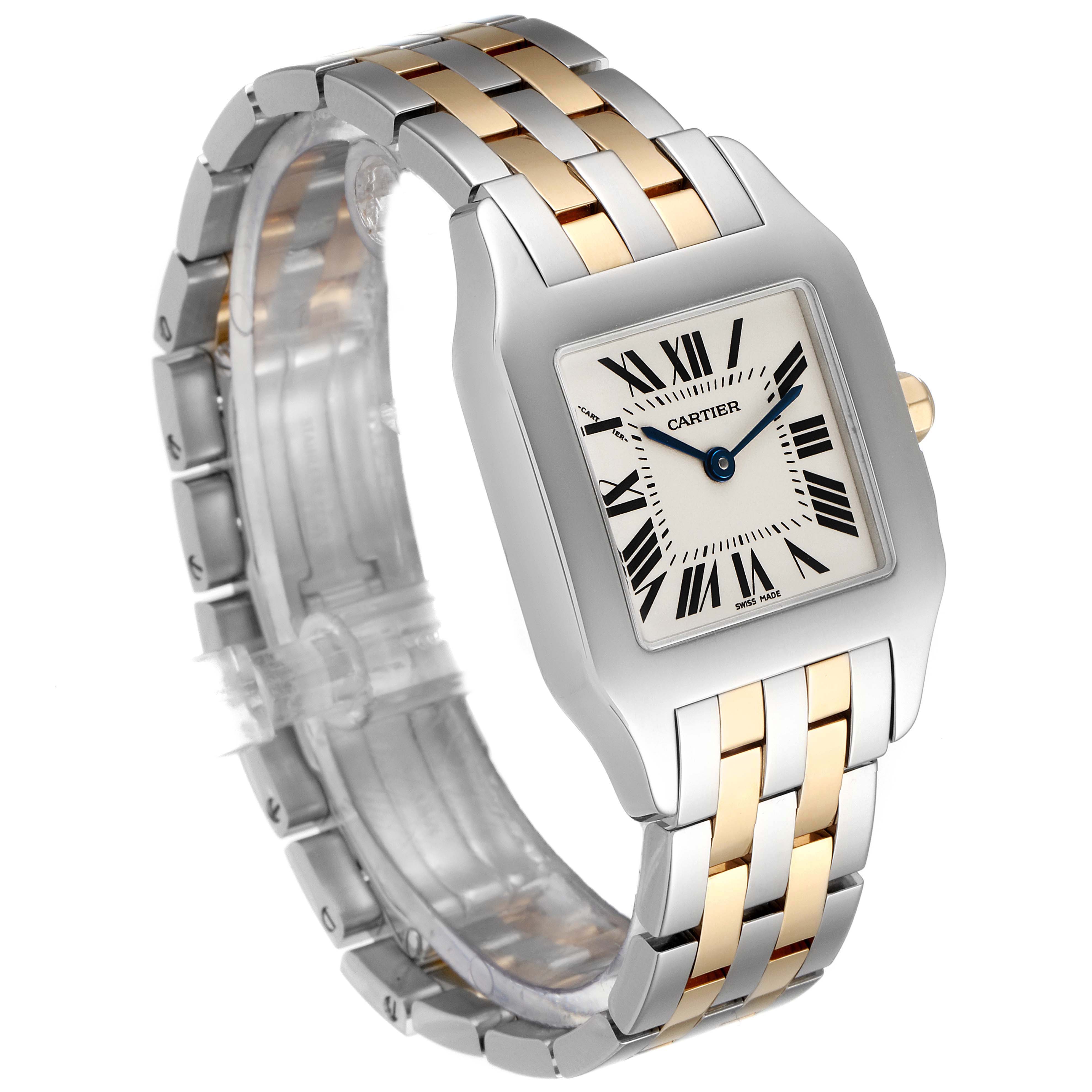 The Cartier Santos W25067Z6 Men
s Steel and Gold (two tone) Silver Dial W25067Z6 Men
s Steel and Gold (two tone) Silver Dial model watch is shown at a three-quarter angle, highlighting its silver and gold bracelet and Roman numeral dial.