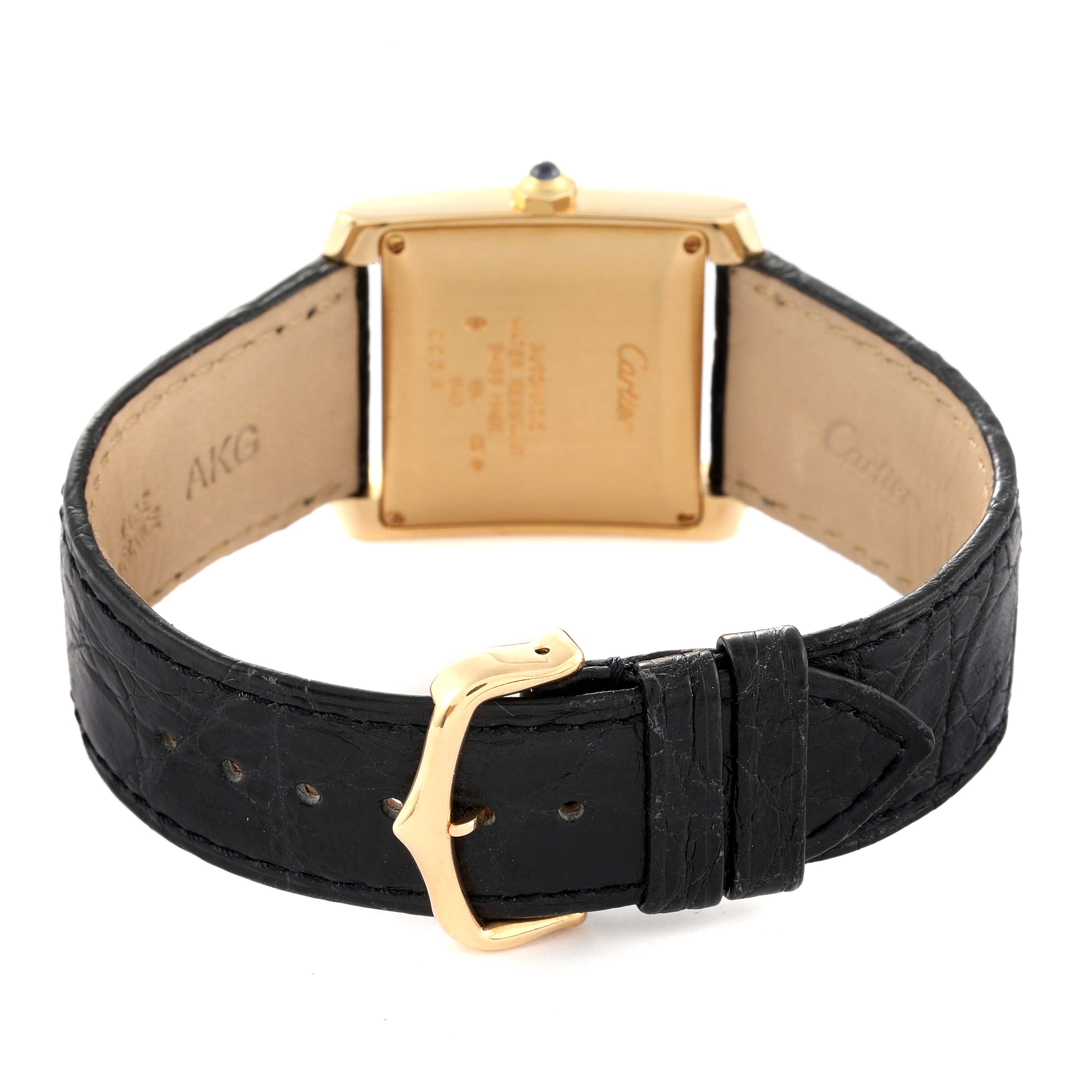 The image shows the backside of the Cartier Tank Francaise W5000156 Men's Yellow Gold Silver Dial W5000156 Men's Yellow Gold Silver Dial watch, focusing on the leather strap and clasp.