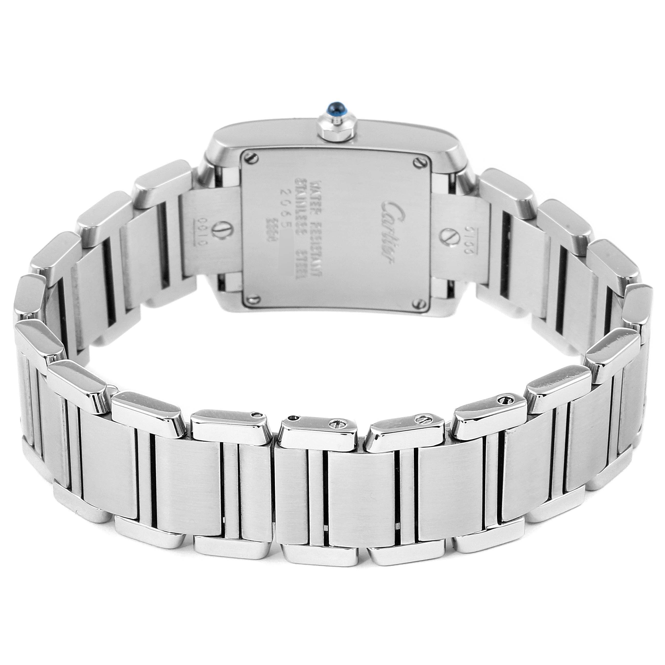 The image shows the back view of the Cartier Tank Française watch, highlighting its stainless steel bracelet and case back.