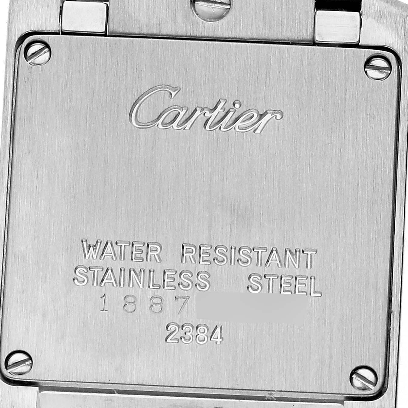 The image shows the back case of a Cartier Tank Francaise W51007Q4 Women's Steel and Gold (two tone) Silver Dial W51007Q4 Women's Steel and Gold (two tone) Silver Dial watch, displaying engravings and screws.