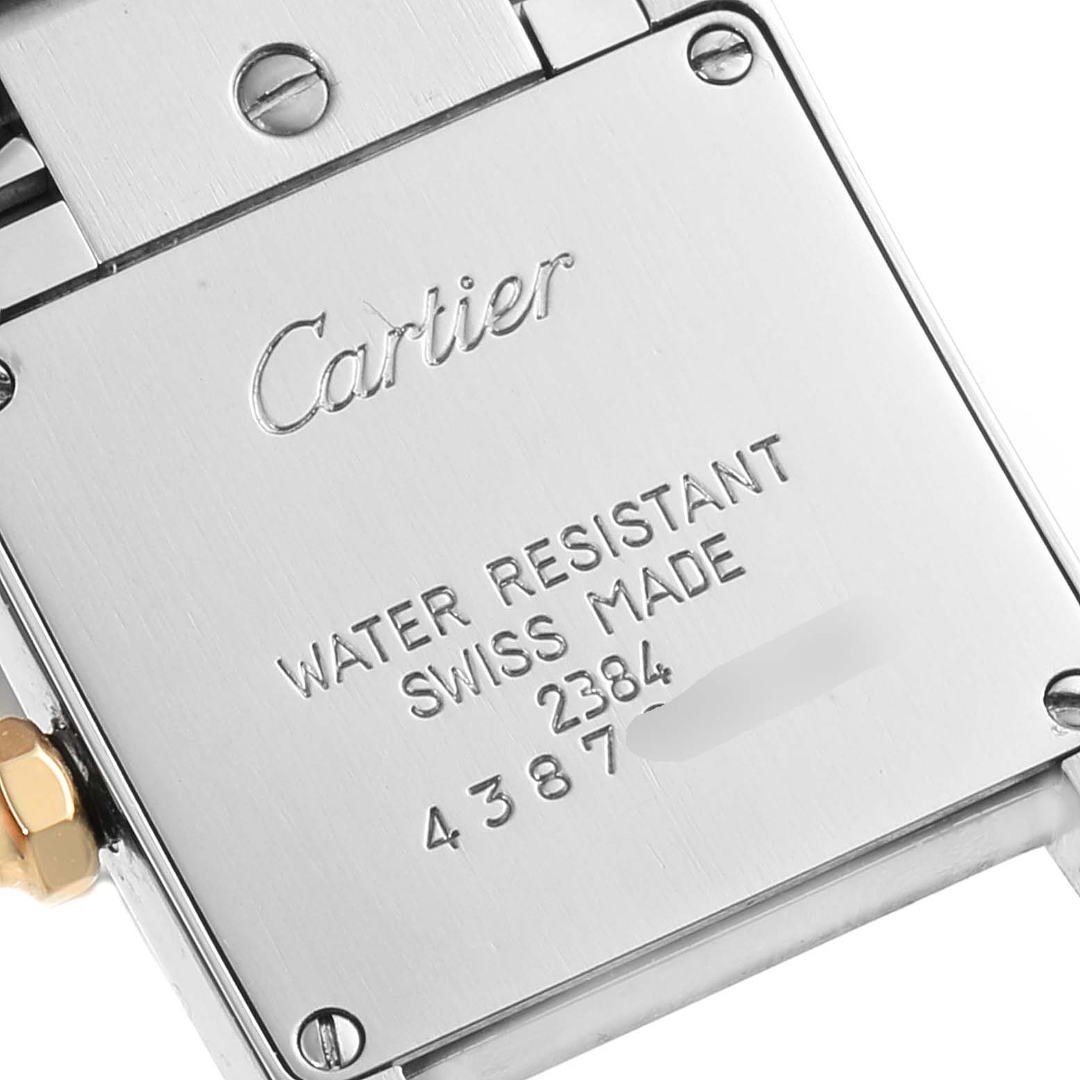 This image shows the back case of a Tank Française model watch by Cartier, displaying the brand name and water resistance details.