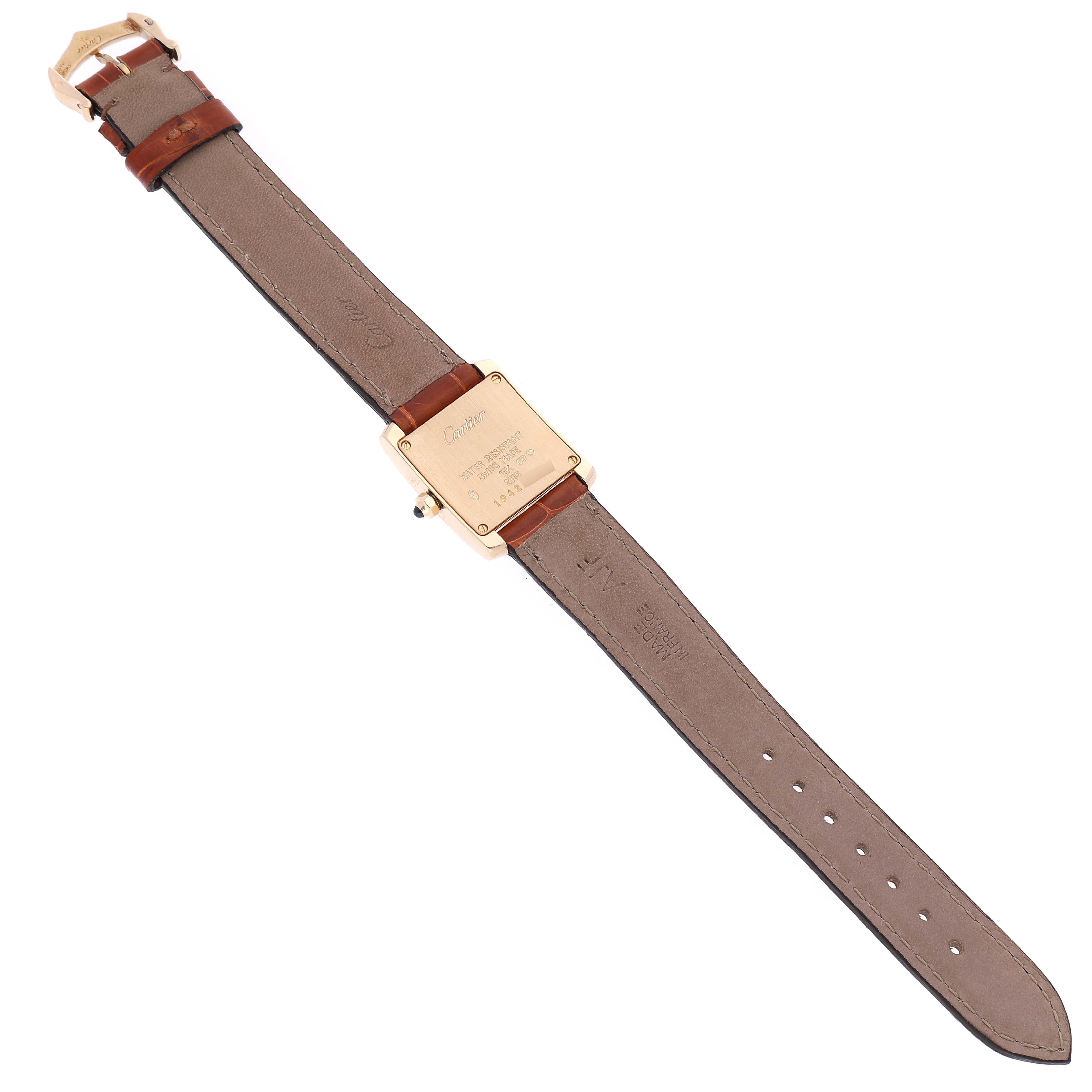 The image shows the back view of a Cartier Tank Francaise W5000256 Women's Yellow Gold Silver Dial W5000256 Women's Yellow Gold Silver Dial watch, highlighting the case back and leather strap with buckle.