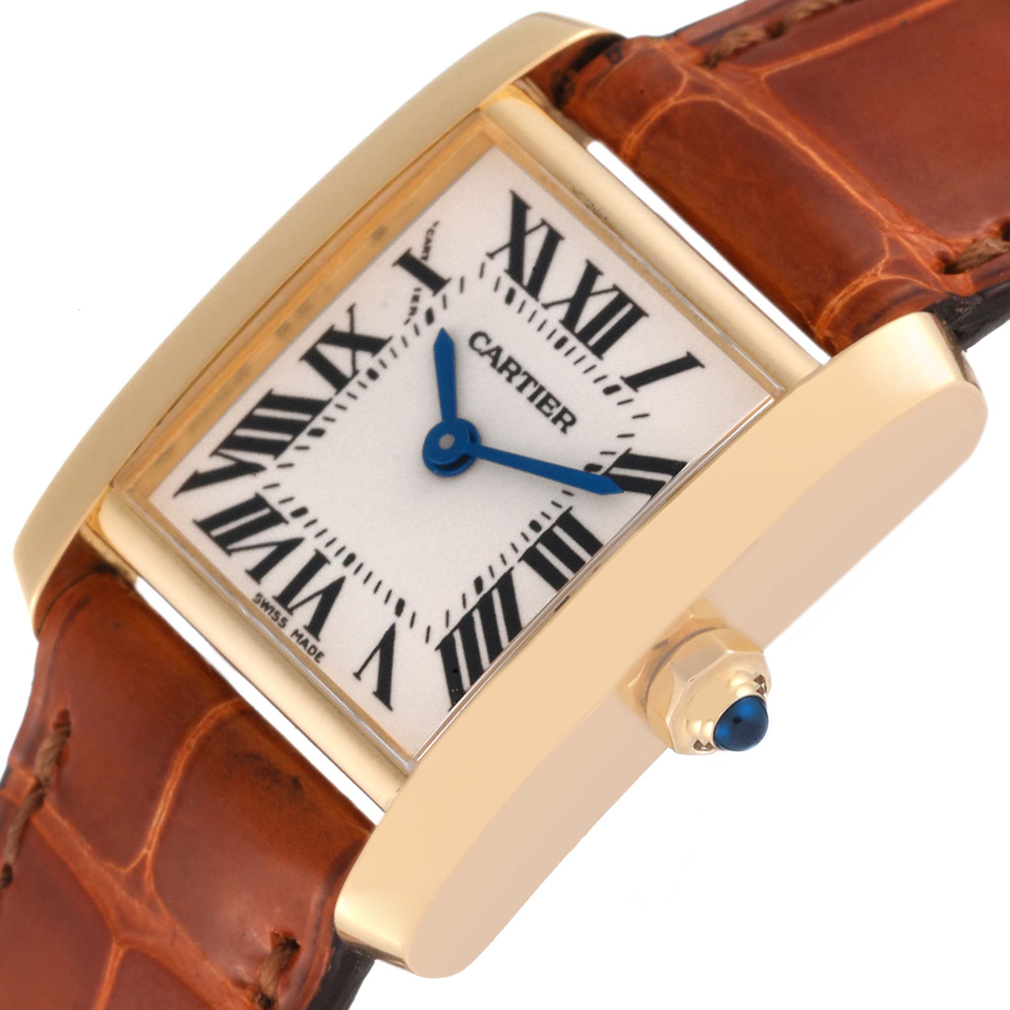 This Cartier Tank Francaise W5000256 Women's Yellow Gold Silver Dial W5000256 Women's Yellow Gold Silver Dial watch is shown from an angled close-up, displaying the bezel, dial, hands, and part of the leather strap.