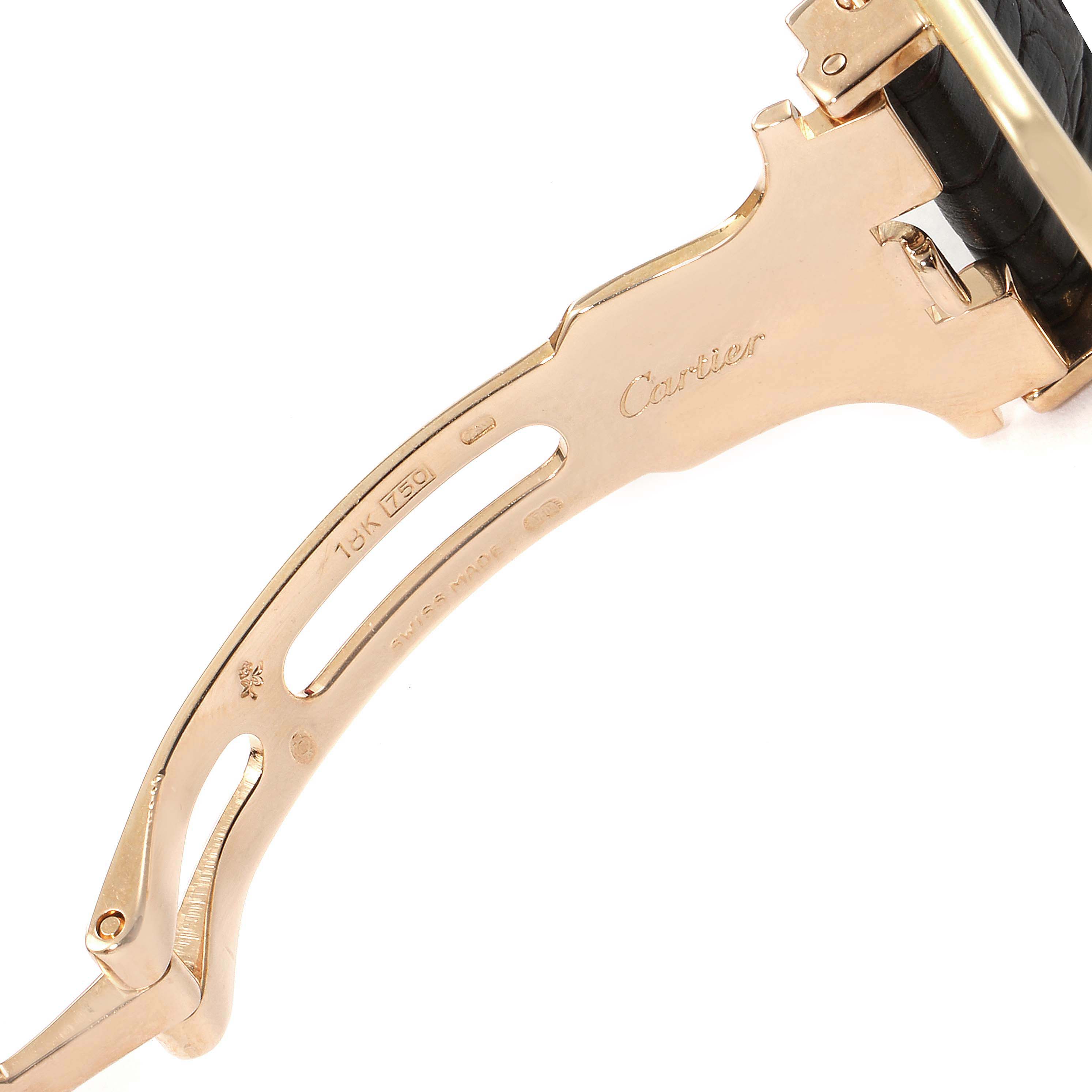 The image shows the clasp and part of the band of a Tank Louis model watch by Cartier, focusing on the gold deployment clasp.