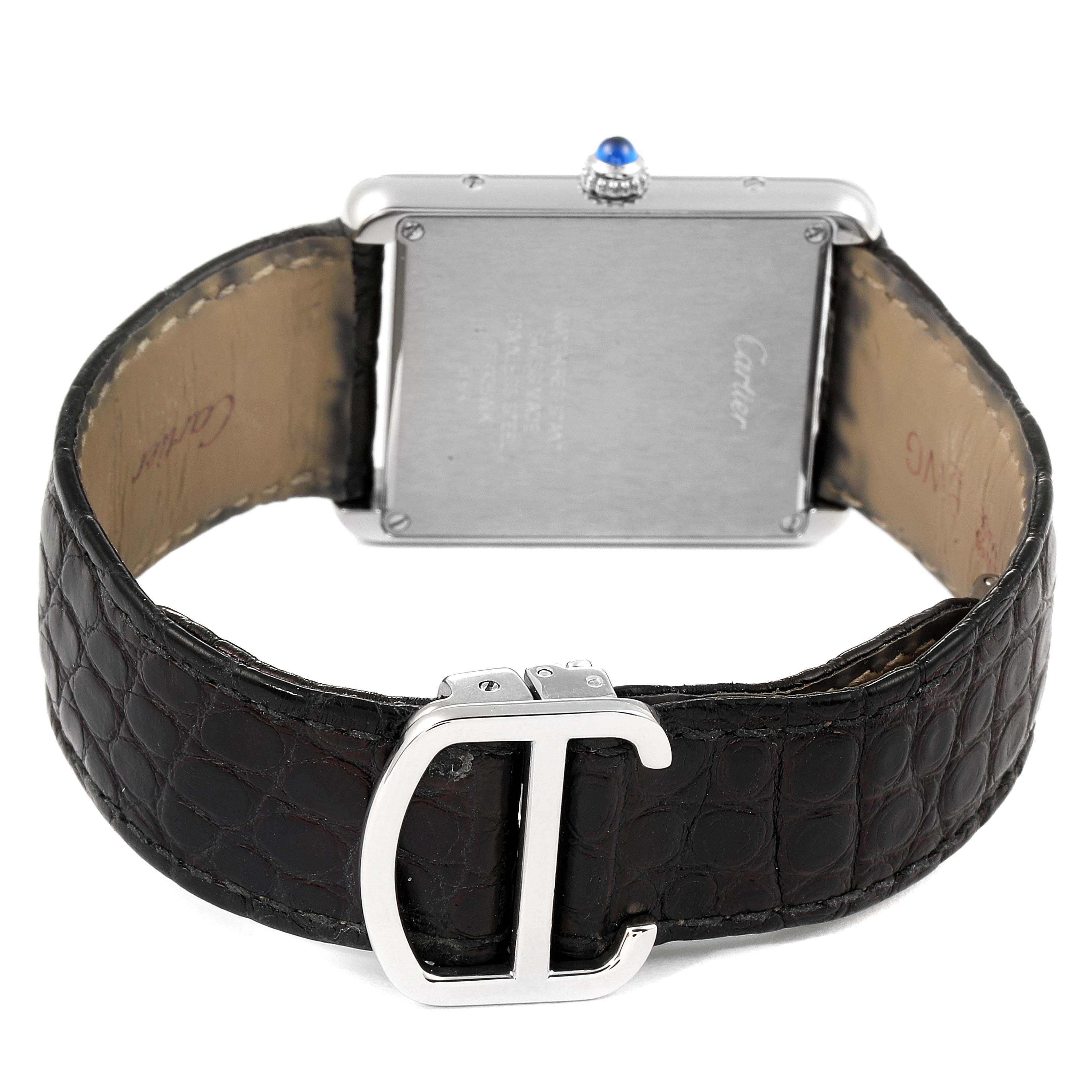 This image shows the back of the Cartier Tank Solo W1018355 Men
s Stainless Steel Silver Dial W1018355 Men
s Stainless Steel Silver Dial watch, featuring its leather strap and metal buckle.