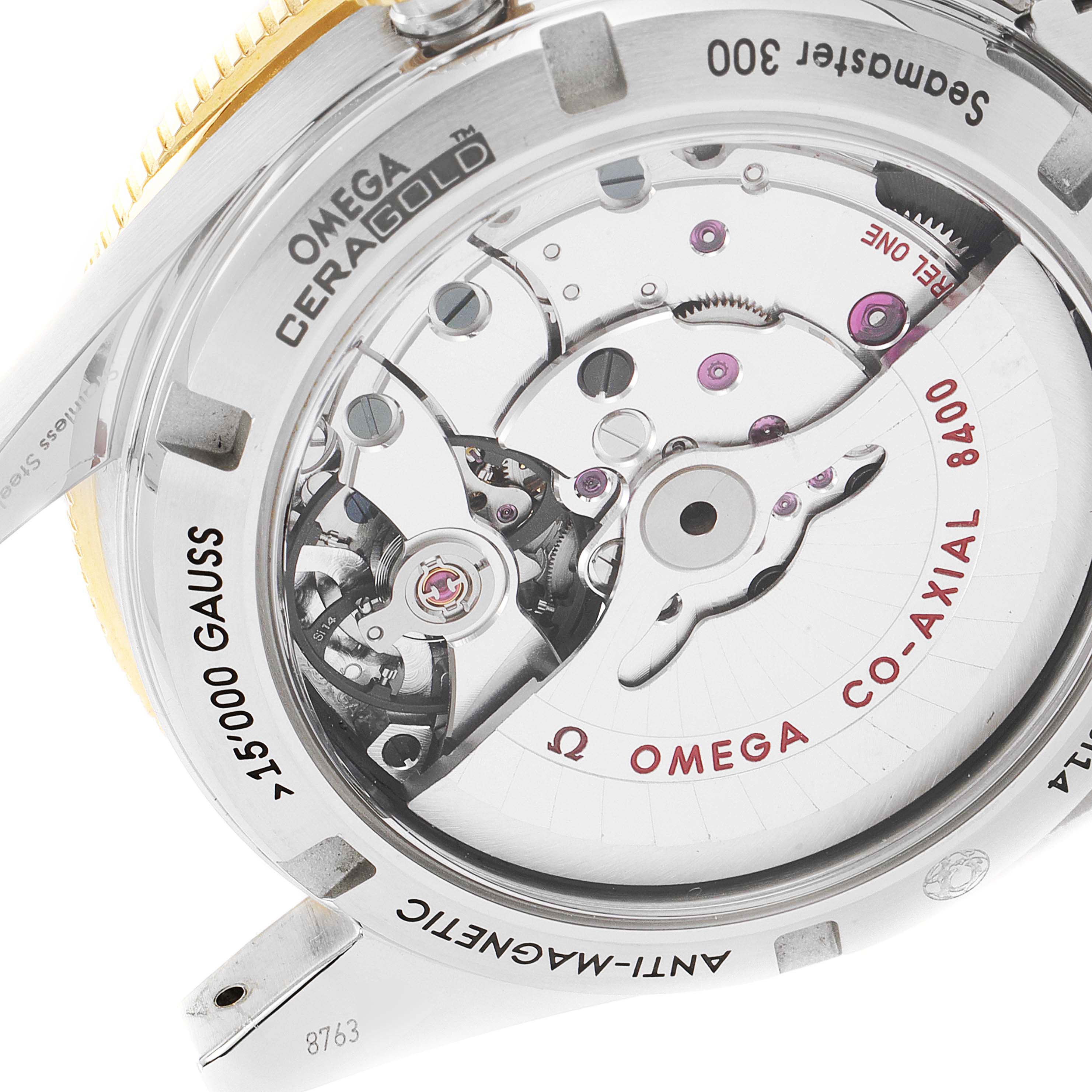 This image shows the back view of an Omega Seamaster 233.20.41.21.01.001 Men's Steel and Gold (two tone) Black Dial 233.20.41.21.01.001 Men's Steel and Gold (two tone) Black Dial watch, highlighting the Co-Axial 8400 movement and anti-magnetic features.