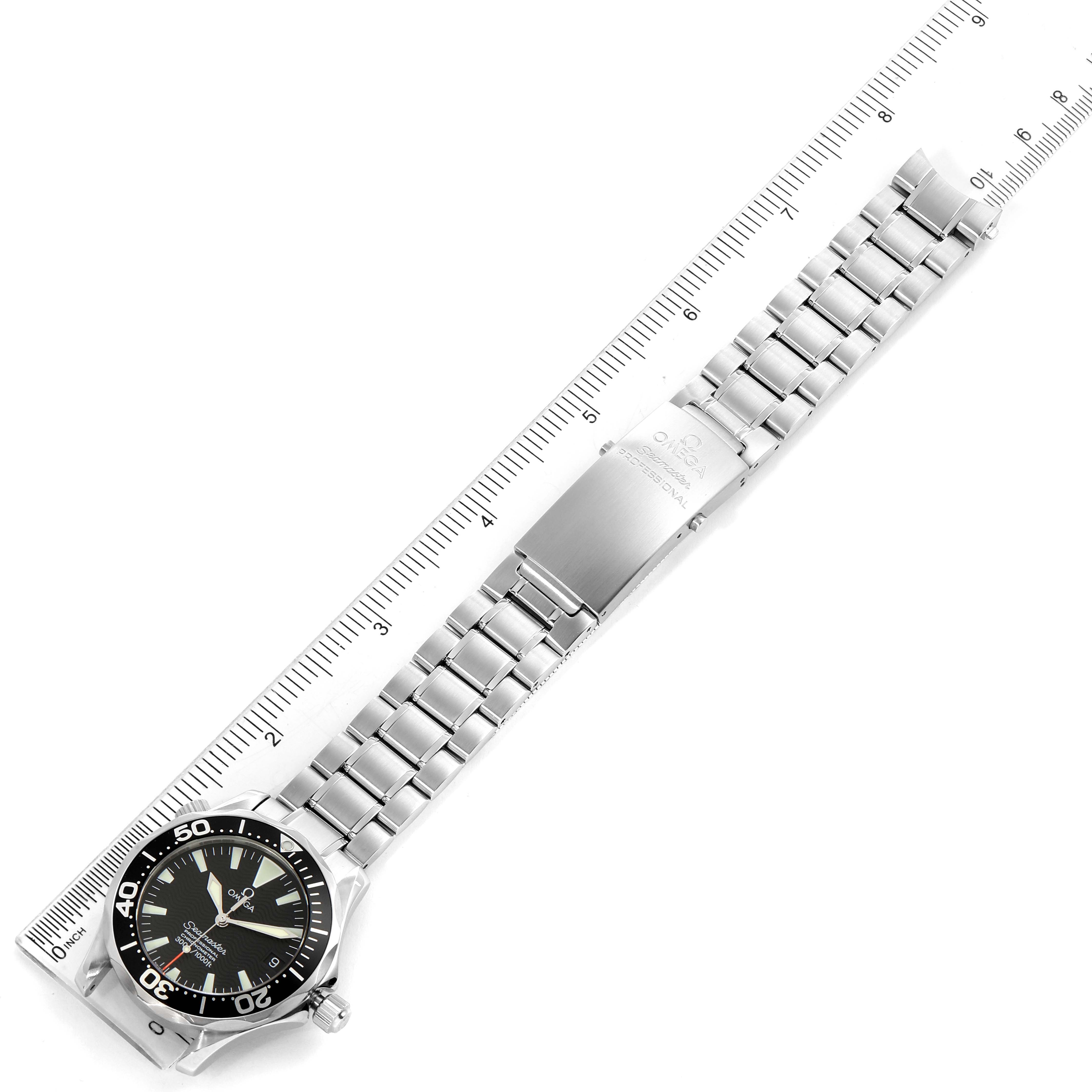 The image shows an Omega Seamaster 2252.50.00 Men
s Stainless Steel Black Dial 2252.50.00 Men
s Stainless Steel Black Dial watch taken from a top-down angle, displaying the full bracelet and watch face, with a ruler for scale.