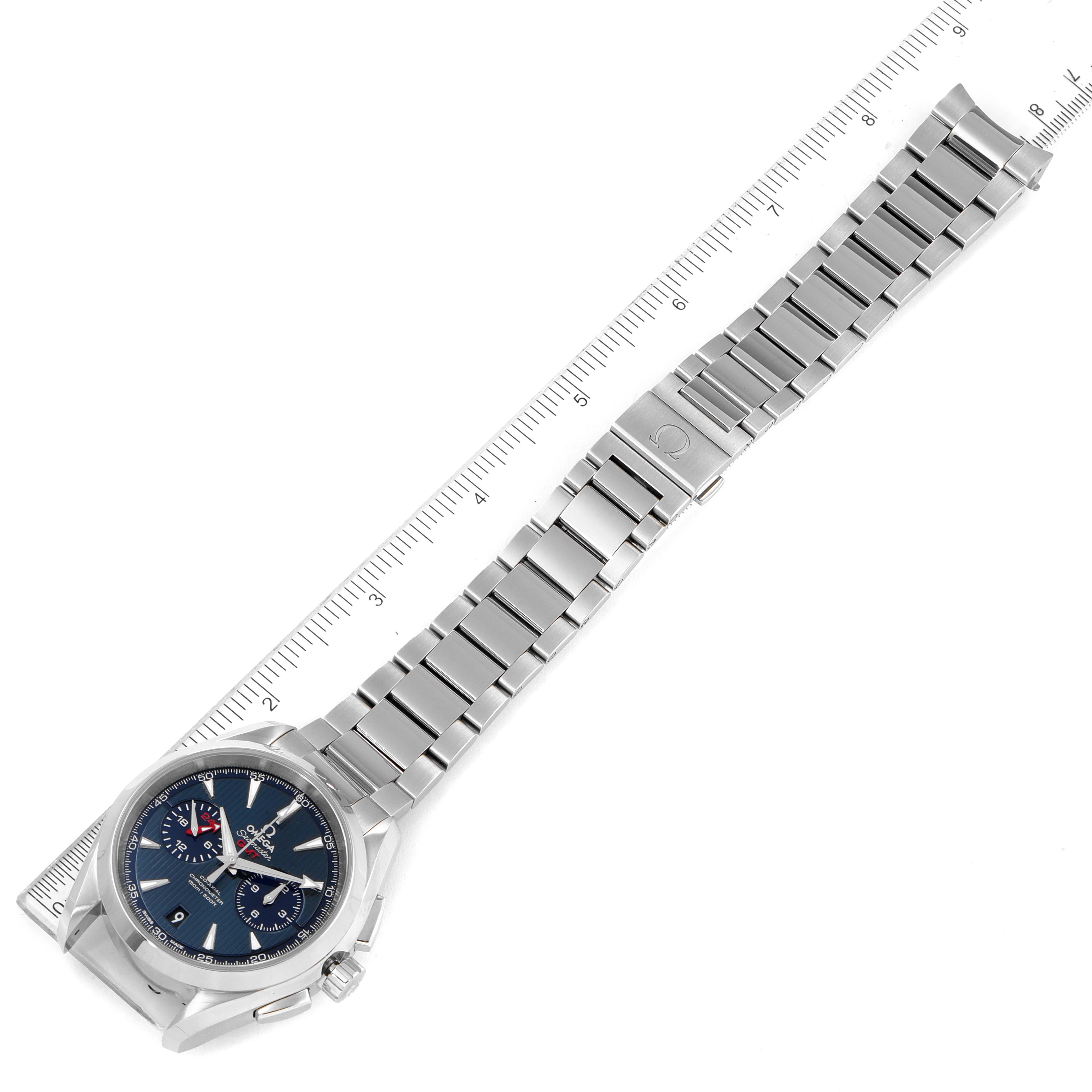 The Omega Aqua Terra 231.10.43.52.03.001 Men's Stainless Steel Blue Dial 231.10.43.52.03.001 Men's Stainless Steel Blue Dial watch is shown from an overhead angle, featuring its face, bracelet, and clasp, aligned next to a ruler.