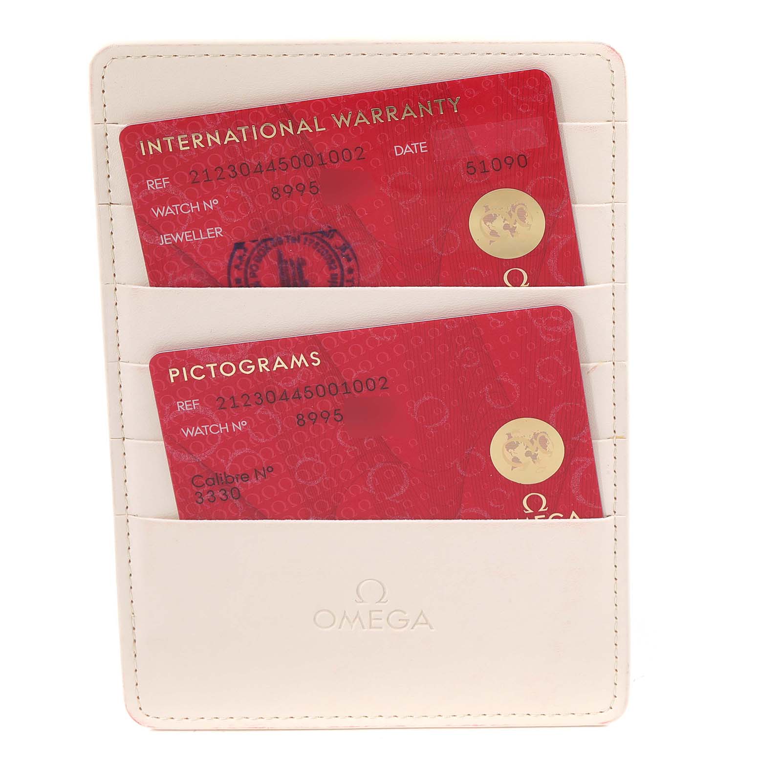 This image shows warranty and pictogram cards for an Omega Seamaster 212.30.44.50.01.002 Men's Stainless Steel Black Dial 212.30.44.50.01.002 Men's Stainless Steel Black Dial, placed in a white cardholder.