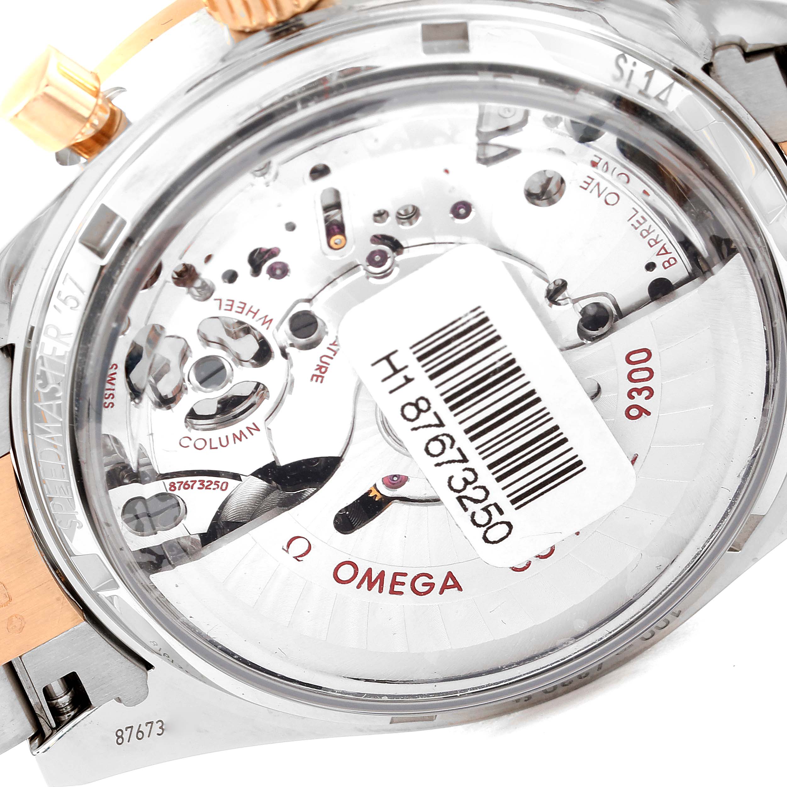 The image shows the back of an Omega Speedmaster 331.20.42.51.01.002 Men's Steel and Gold (two tone) Black Dial 331.20.42.51.01.002 Men's Steel and Gold (two tone) Black Dial watch, highlighting the inner movement and the 9300 caliber mechanism.