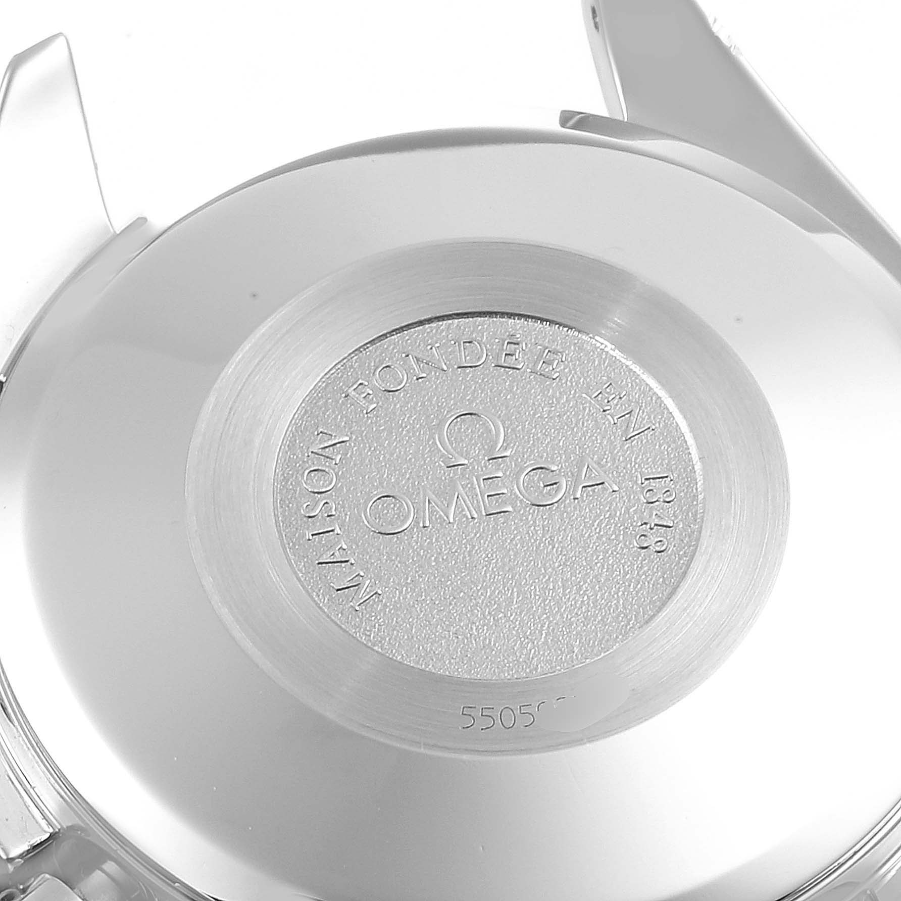 The image shows the back case of an Omega Speedmaster 3521.80.00 Men
s Stainless Steel Blue Dial 3521.80.00 Men
s Stainless Steel Blue Dial watch from a close-up angle.