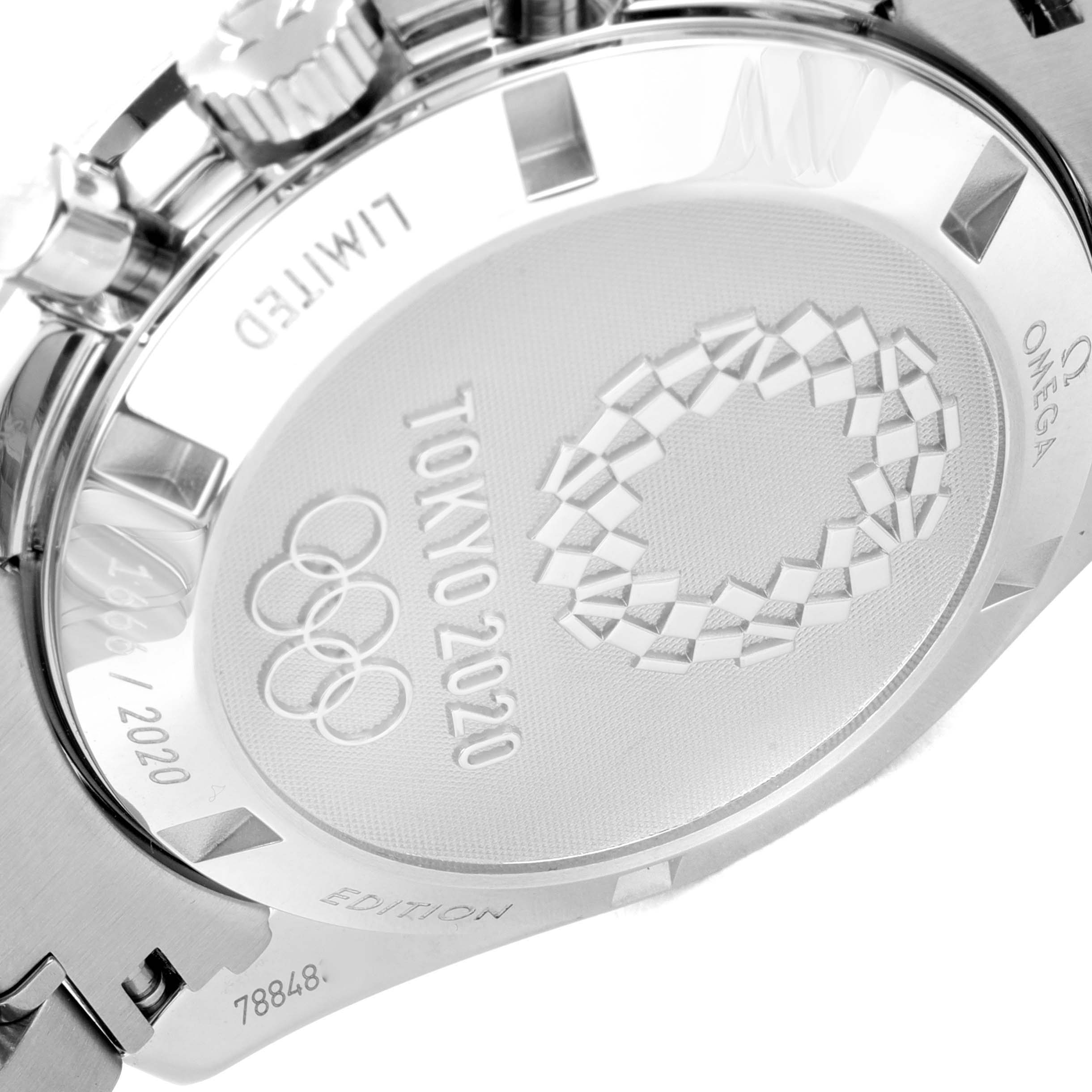 This image shows the back case of an Omega Speedmaster 522.30.42.30.03.001 Men's Stainless Steel Blue Dial 522.30.42.30.03.001 Men's Stainless Steel Blue Dial watch with "Tokyo 2020" engraving and the Olympic rings.