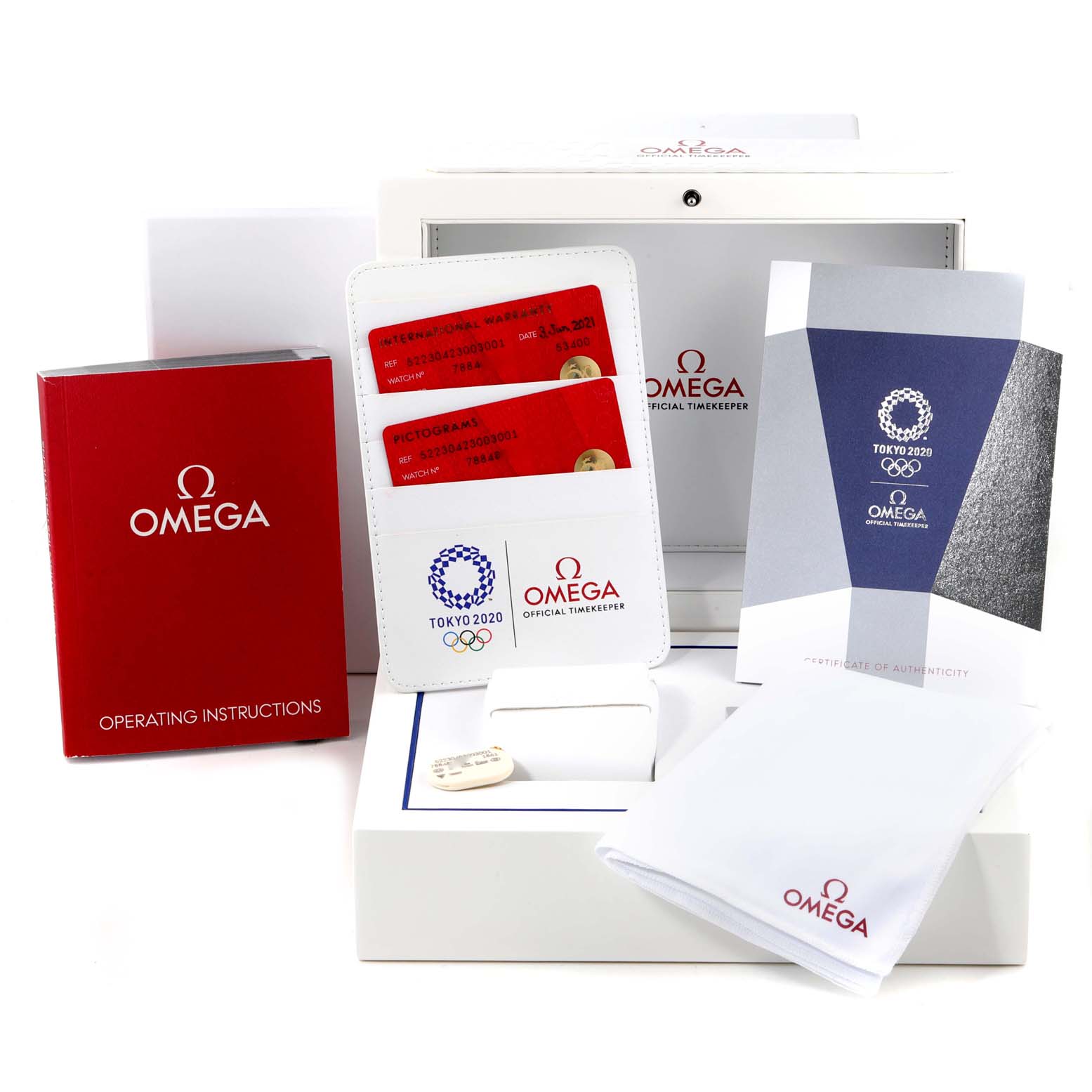 This image shows the packaging, operating instructions, warranty cards, authenticity certificate, and cleaning cloth for the Omega Speedmaster 522.30.42.30.03.001 Men's Stainless Steel Blue Dial 522.30.42.30.03.001 Men's Stainless Steel Blue Dial.