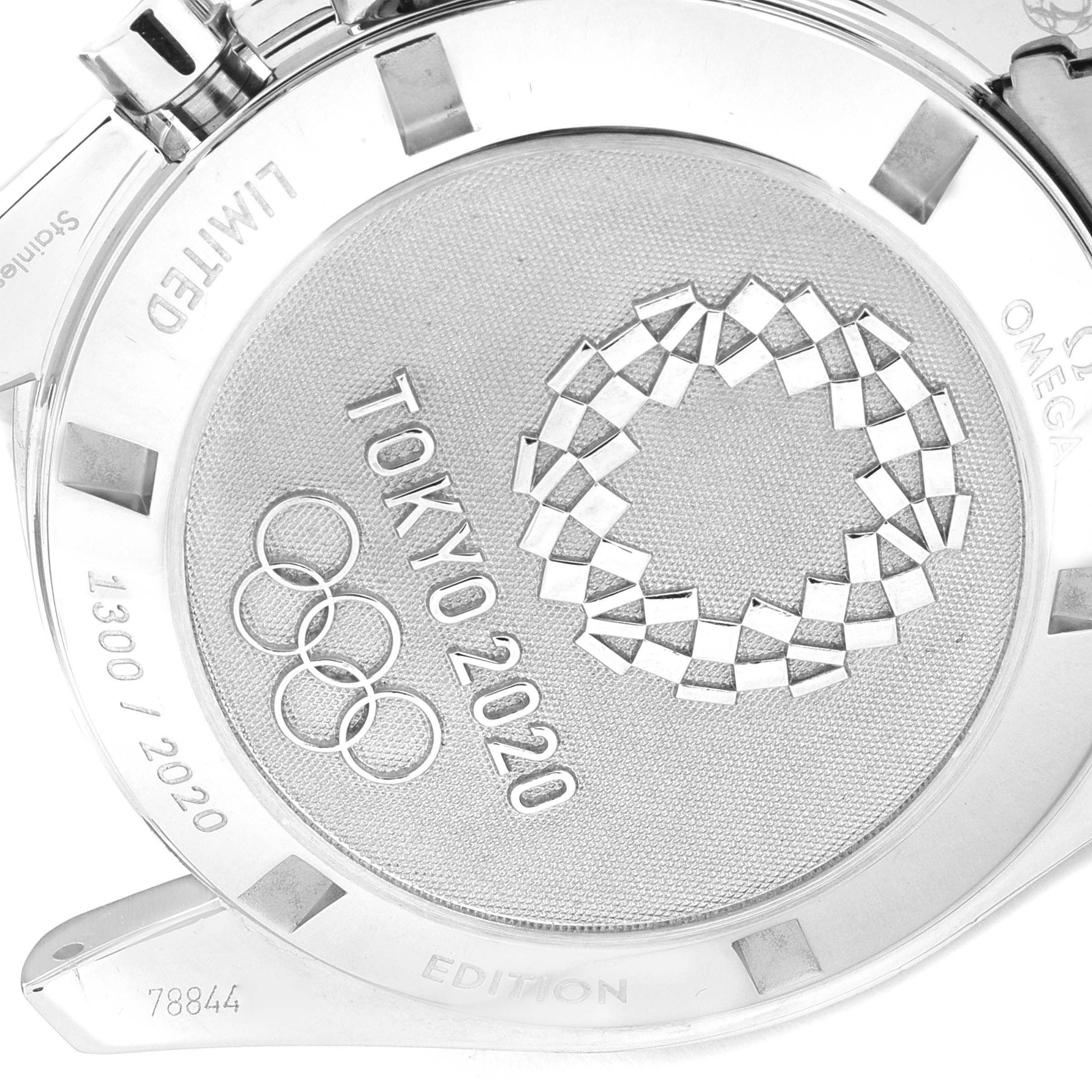 The image shows the case back of an Omega Speedmaster 522.30.42.30.04.001 Men's Stainless Steel White Dial 522.30.42.30.04.001 Men's Stainless Steel White Dial watch, featuring Tokyo 2020 Olympics engravings.