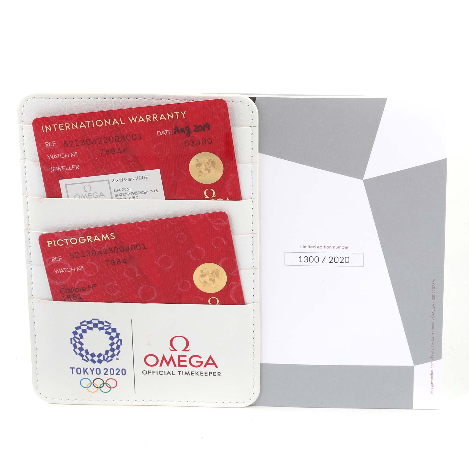 This image shows the warranty cards and limited edition certificate for the Omega Speedmaster 522.30.42.30.04.001 Men's Stainless Steel White Dial 522.30.42.30.04.001 Men's Stainless Steel White Dial watch.