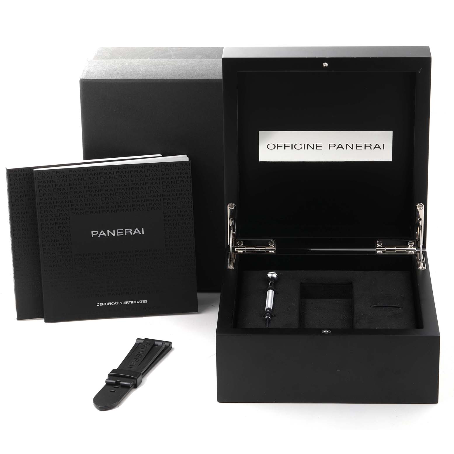 The image shows an open Panerai Luminor PAM00725 Men's Ceramic Black Dial PAM00725 Men's Ceramic Black Dial watch box, an extra strap, a tool, and accompanying booklets.