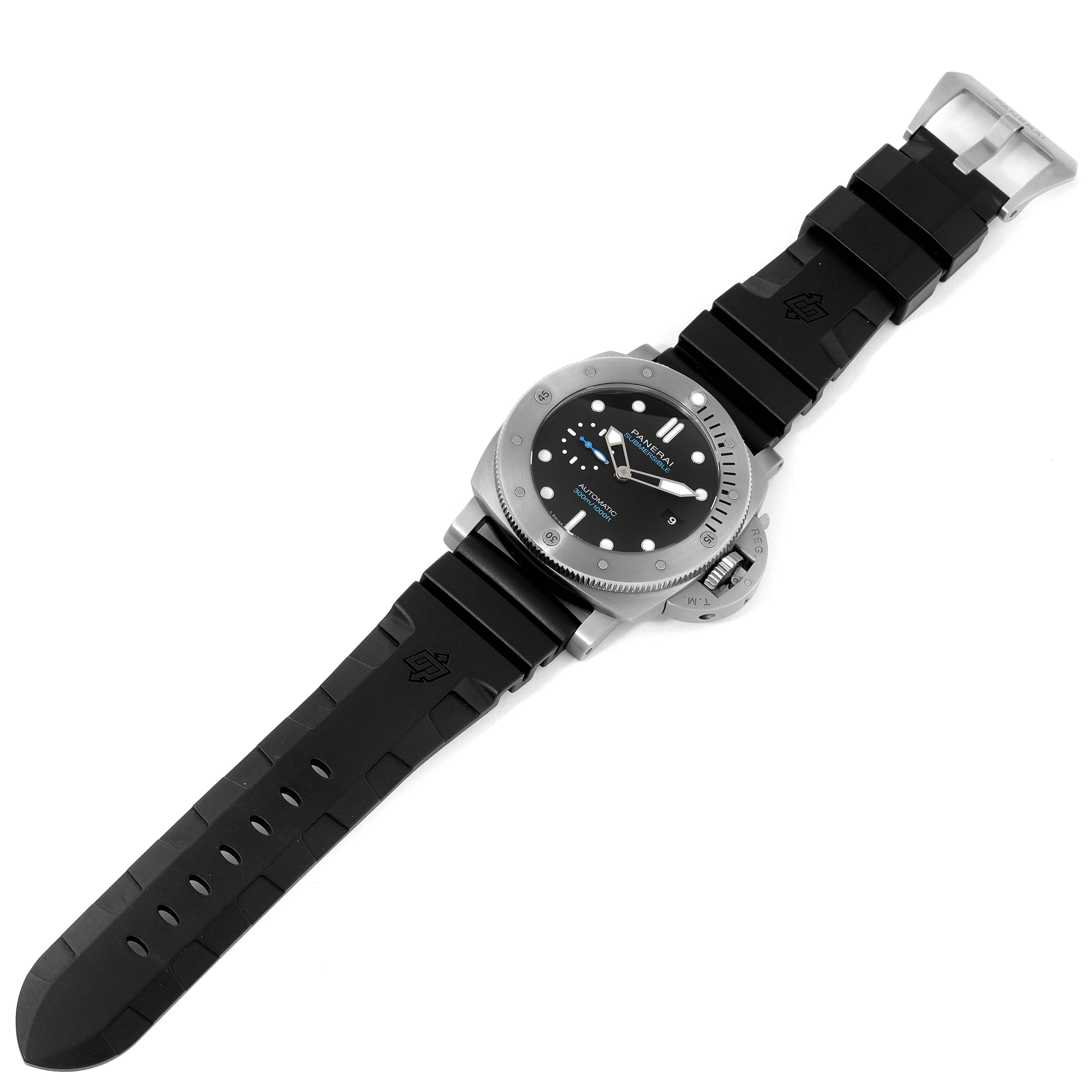The image shows a Panerai Submersible PAM01305 Men's Stainless Steel Black Dial PAM01305 Men's Stainless Steel Black Dial watch laid flat, showcasing its face, bezel, strap, and buckle from a slightly angled top-down view.