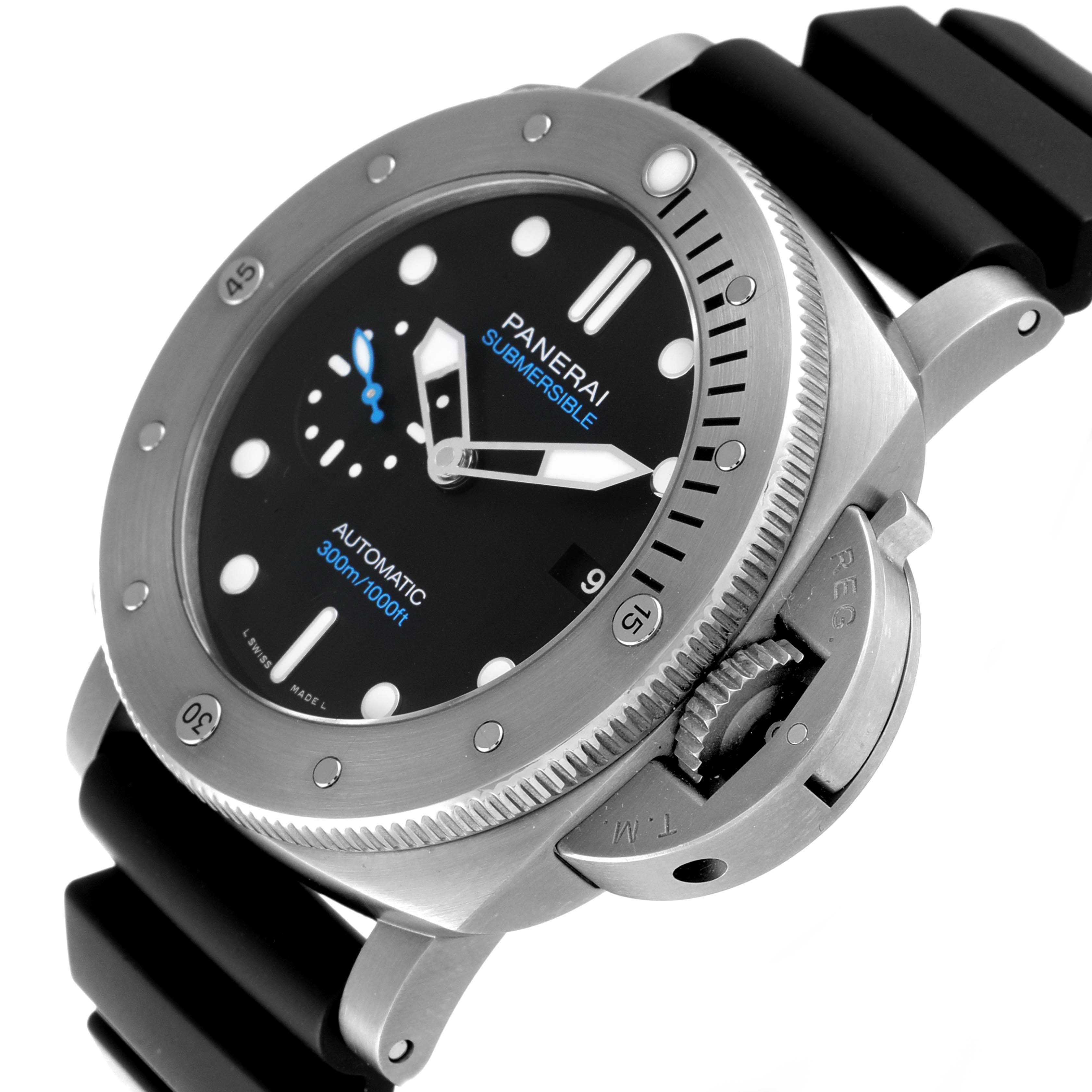 The image shows a close-up angle of the Panerai Submersible PAM01305 Men's Stainless Steel Black Dial PAM01305 Men's Stainless Steel Black Dial watch, highlighting the bezel, crown guard, and black rubber strap.