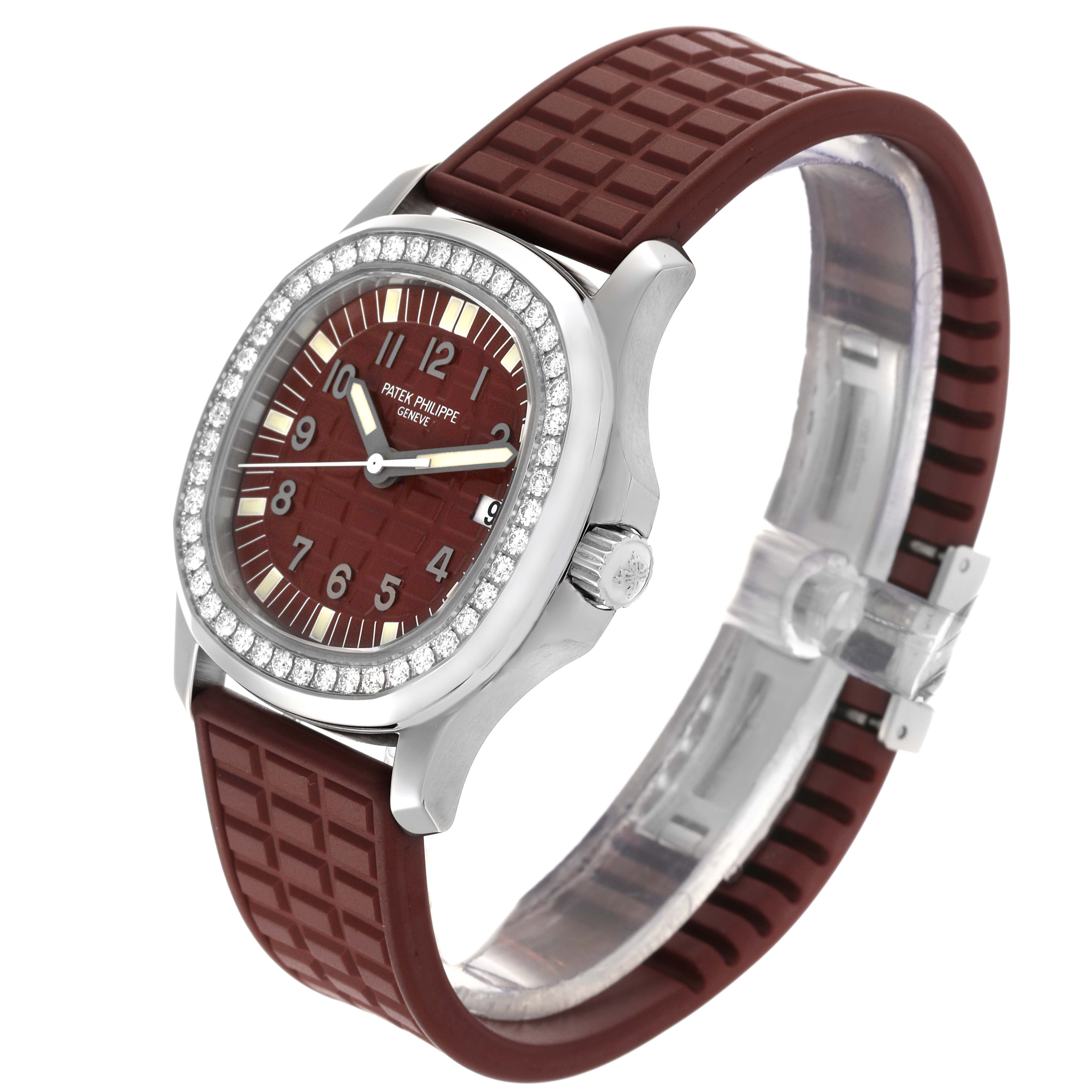 The Patek Philippe Aquanaut 5067A-027 Women's Stainless Steel Red Dial 5067A-027 Women's Stainless Steel Red Dial watch is shown at a three-quarter angle, highlighting the face, bezel, and textured strap.