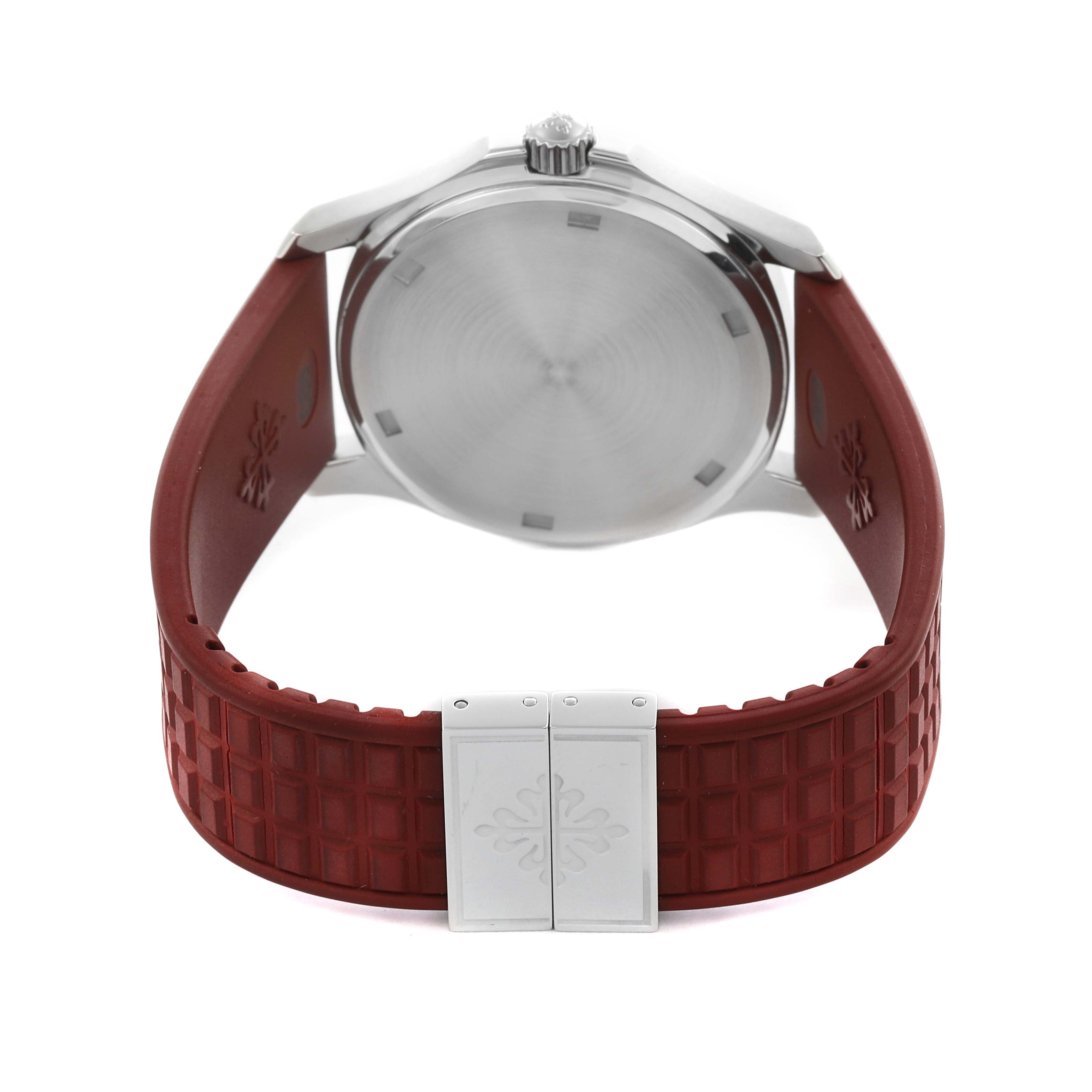 The image shows the back view of the Patek Philippe Aquanaut 5067A-027 Women's Stainless Steel Red Dial 5067A-027 Women's Stainless Steel Red Dial watch featuring its case back, crown, and red textured strap.