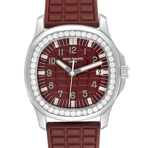 The Patek Philippe Aquanaut watch is shown from a front angle, highlighting the dial, bezel, and part of the strap.