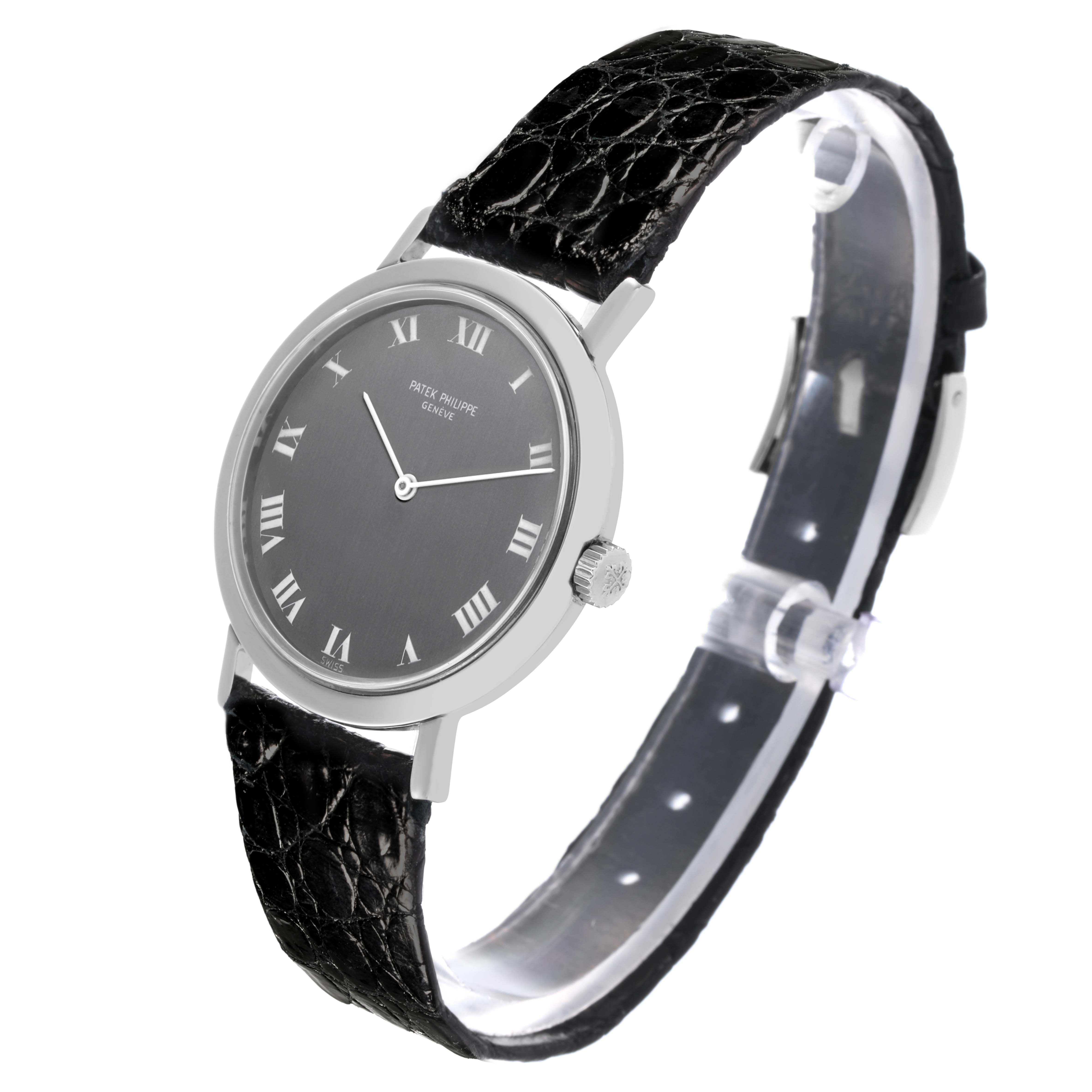 The Patek Philippe Calatrava 3509A Men's Stainless Steel Grey Dial 3509A Men's Stainless Steel Grey Dial watch is shown at an angle displaying the face, side, and leather strap.