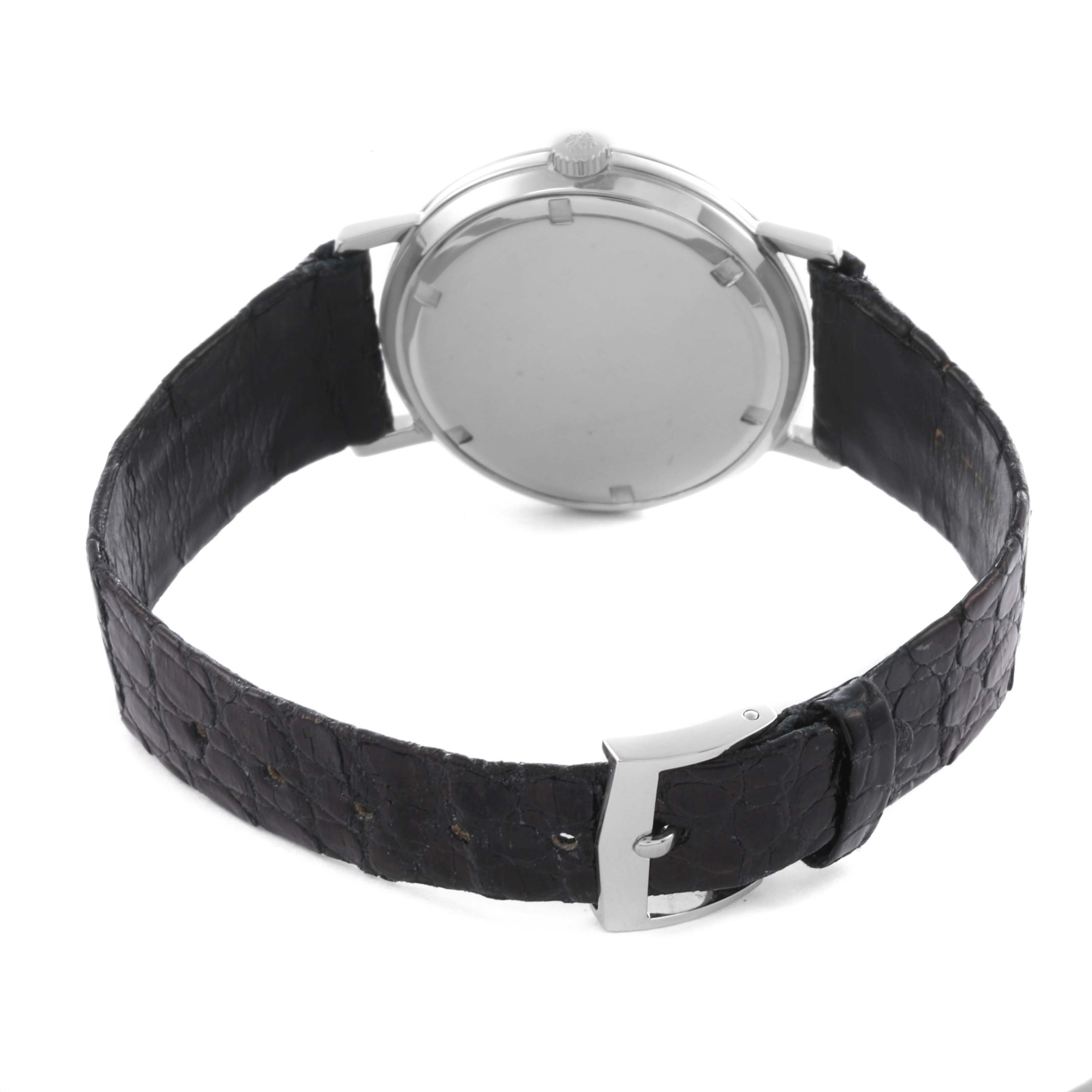 The image shows the back view of a Patek Philippe Calatrava 3509A Men's Stainless Steel Grey Dial 3509A Men's Stainless Steel Grey Dial watch, highlighting the case, crown, and black leather strap with a clasp.