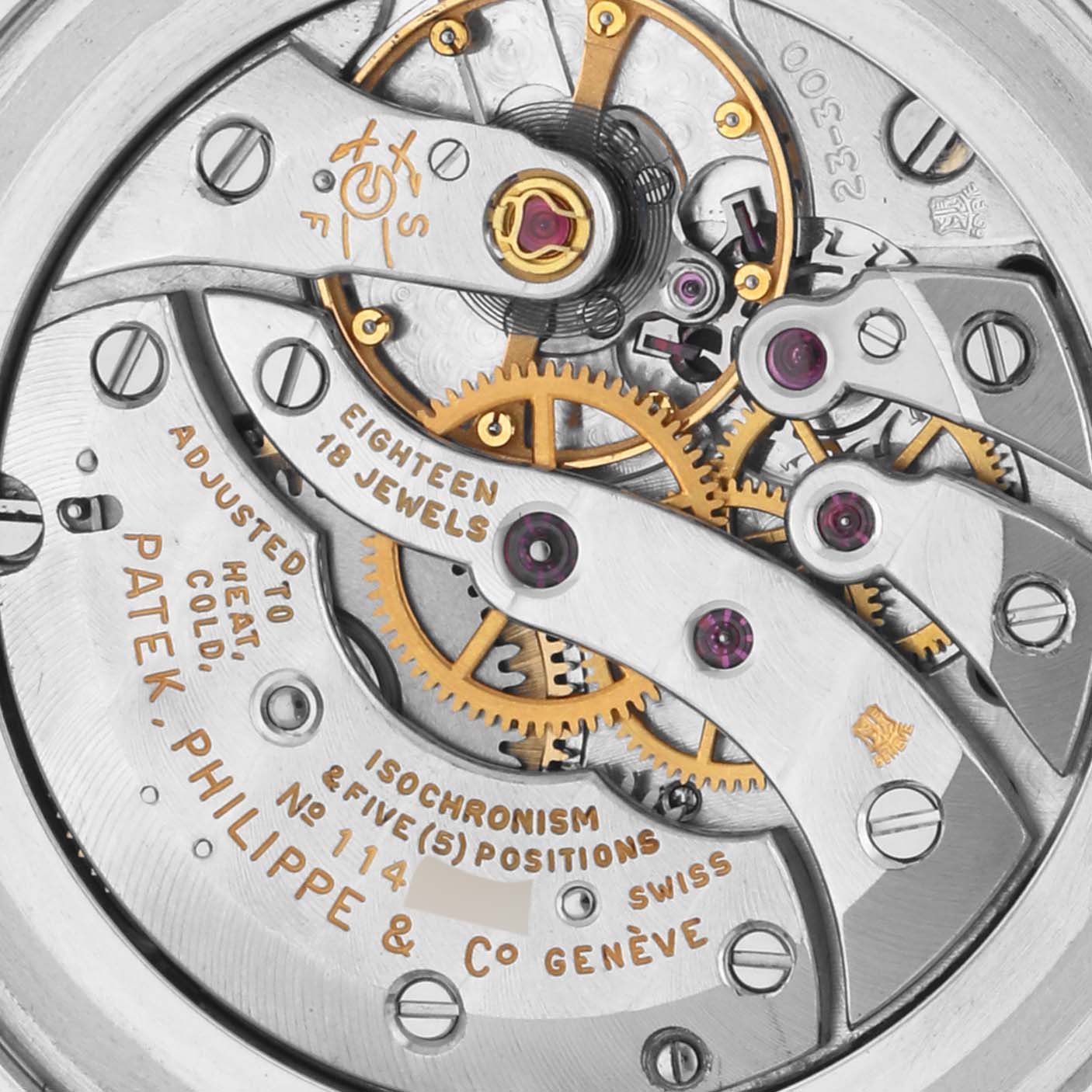 The image shows a close-up of the movement of a Patek Philippe Calatrava 3509A Men's Stainless Steel Grey Dial 3509A Men's Stainless Steel Grey Dial, highlighting gears and inscriptions.