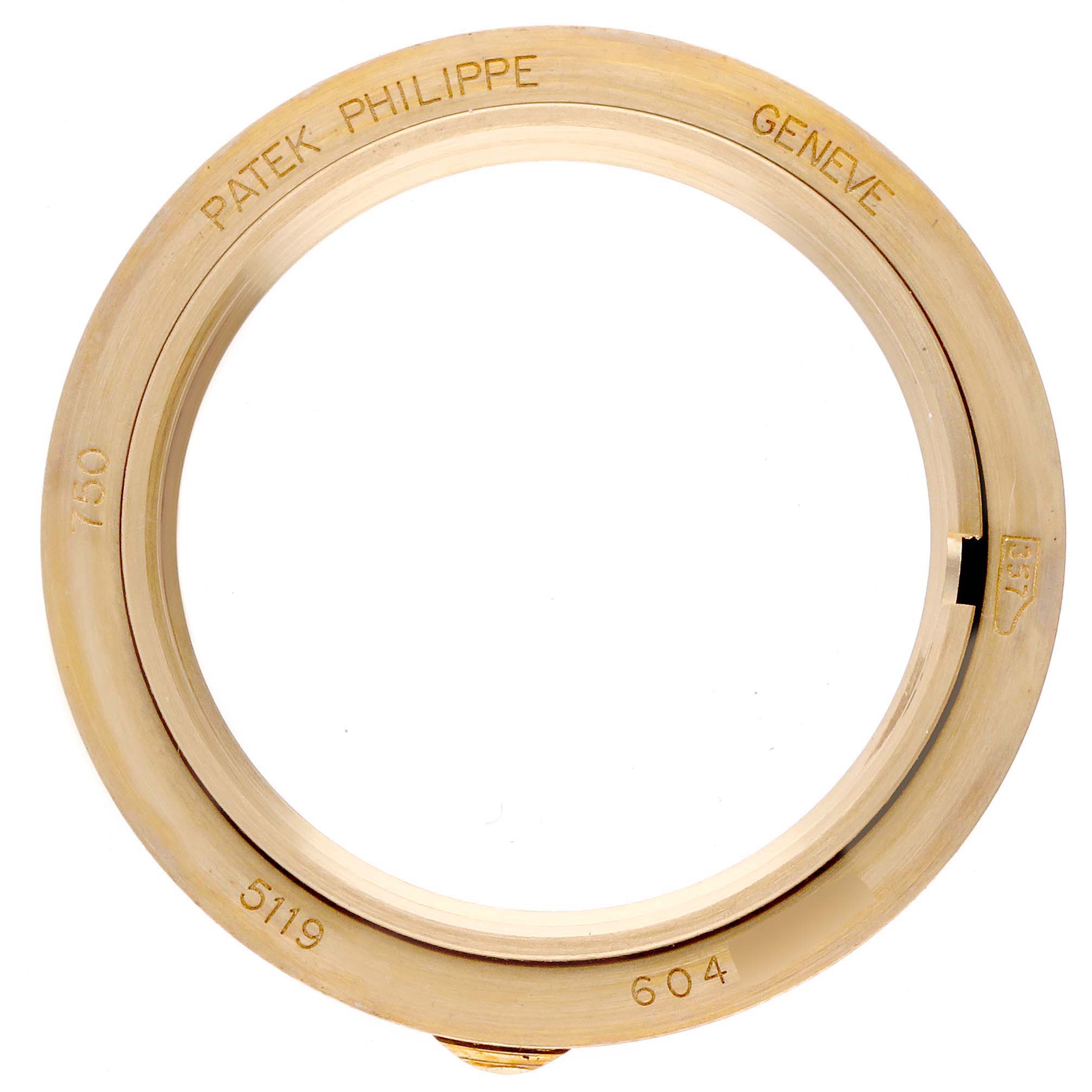 The image shows a gold bezel for the Patek Philippe Calatrava 5119J-001 Men's Yellow Gold White Dial 5119J-001 Men's Yellow Gold White Dial 5119, viewed from a top angle with engravings visible.