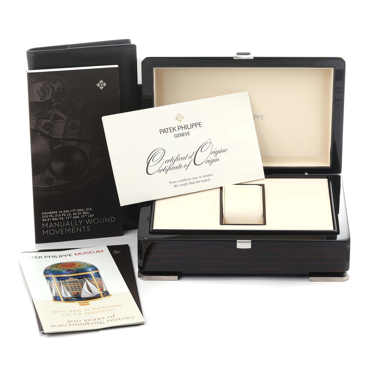 The image shows a Patek Philippe Calatrava 5119J-001 Men's Yellow Gold White Dial 5119J-001 Men's Yellow Gold White Dial's box, certificate, and manuals from a front angle.