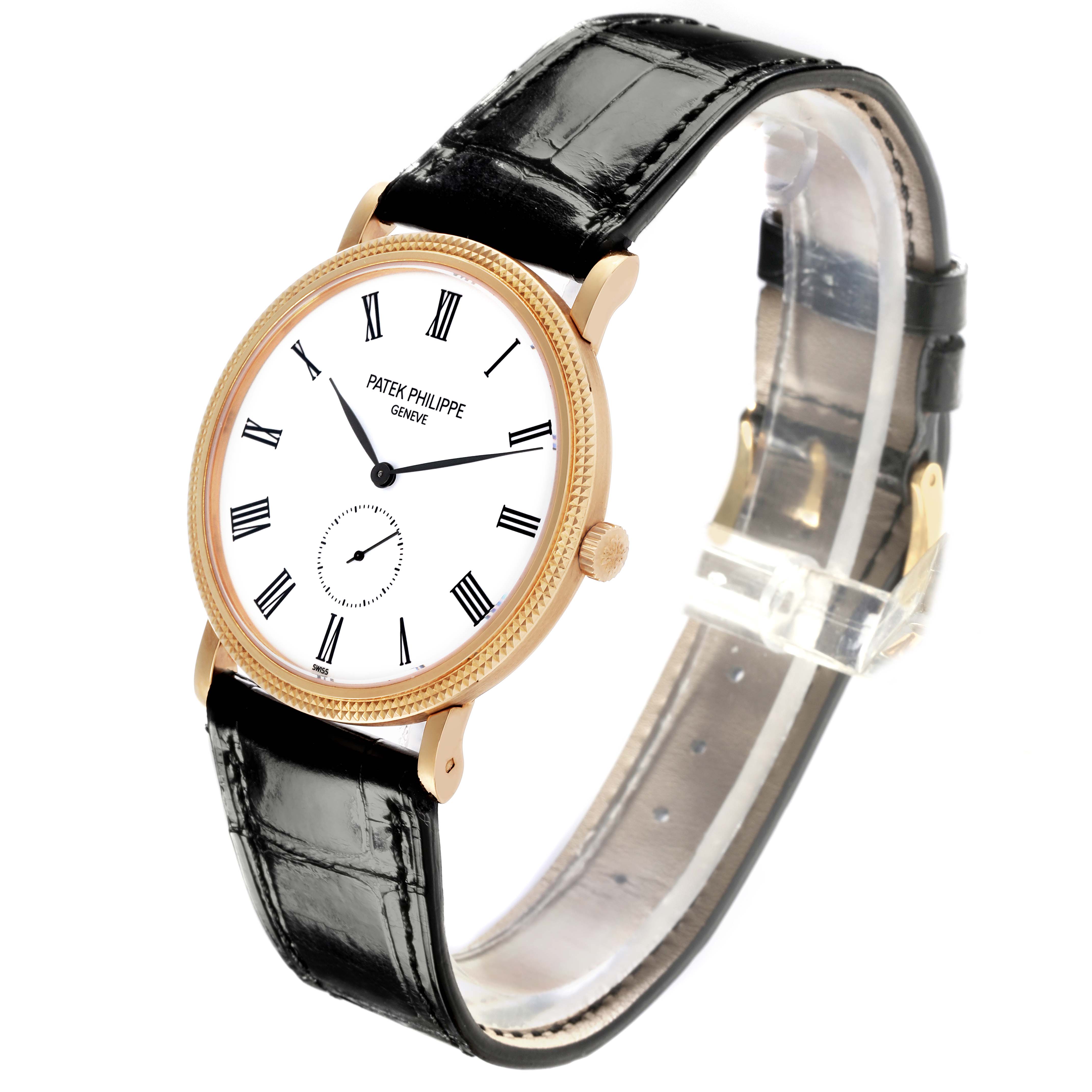 The Patek Philippe Calatrava 5119J-001 Men's Yellow Gold White Dial 5119J-001 Men's Yellow Gold White Dial watch is shown at an angle highlighting its face, crown, and black leather strap.