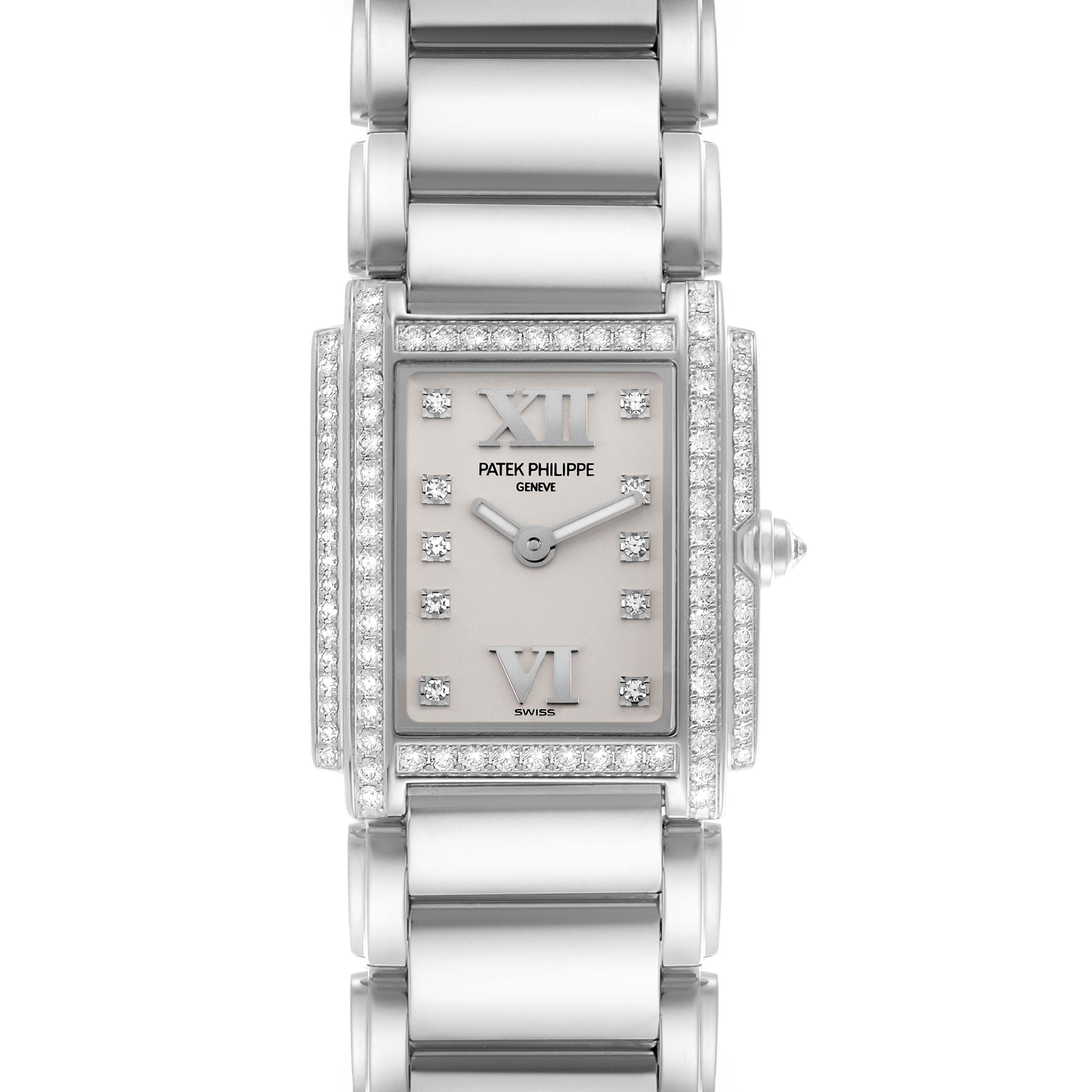 The image shows a front view of the Patek Philippe Twenty-4 4908/200G-011 Women's White Gold Silver Dial 4908/200G-011 Women's White Gold Silver Dial watch, highlighting its diamond-set bezel and bracelet.