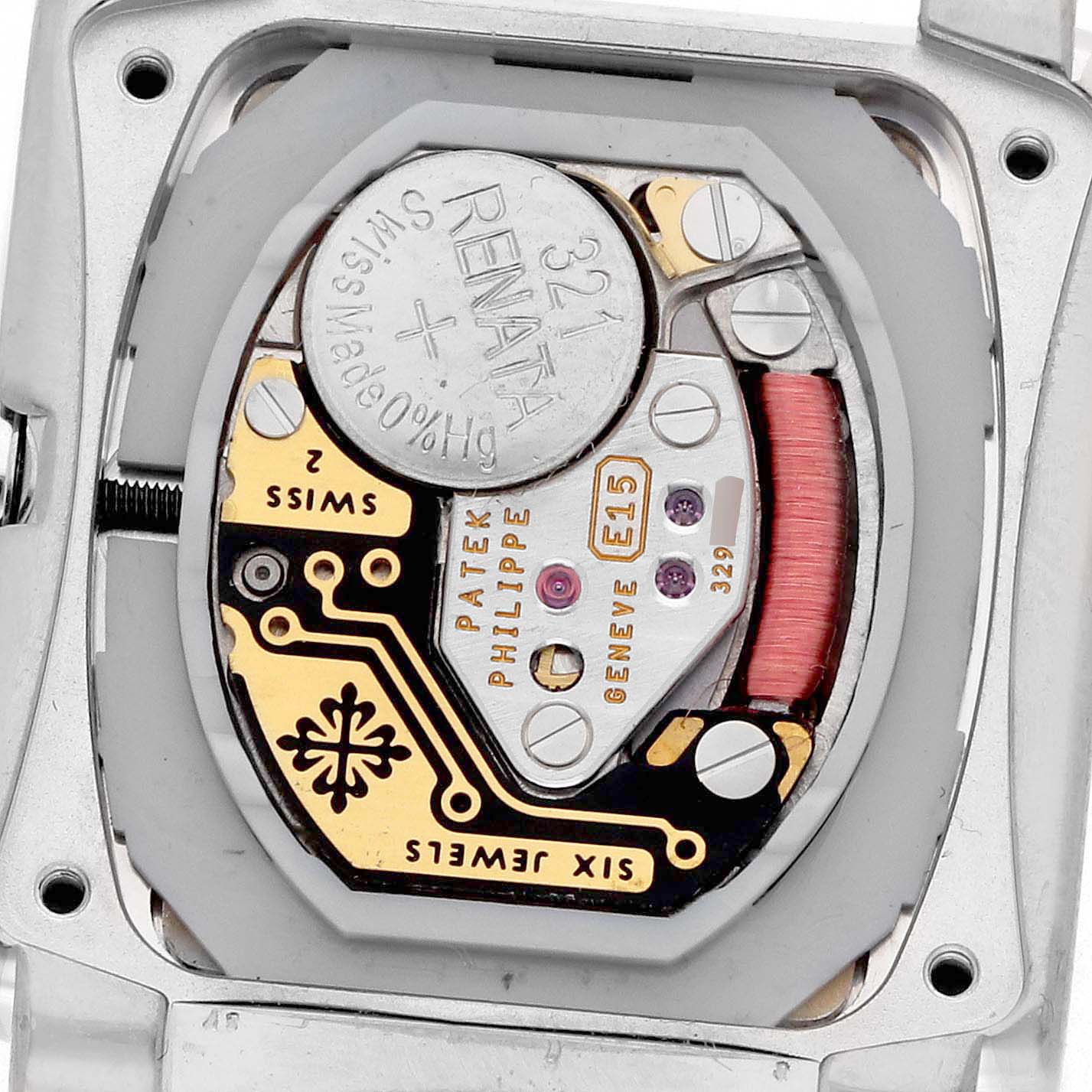 The image shows the back view of a Patek Philippe Twenty-4 4908/200G-011 Women's White Gold Silver Dial 4908/200G-011 Women's White Gold Silver Dial model, highlighting its exposed movement and battery.