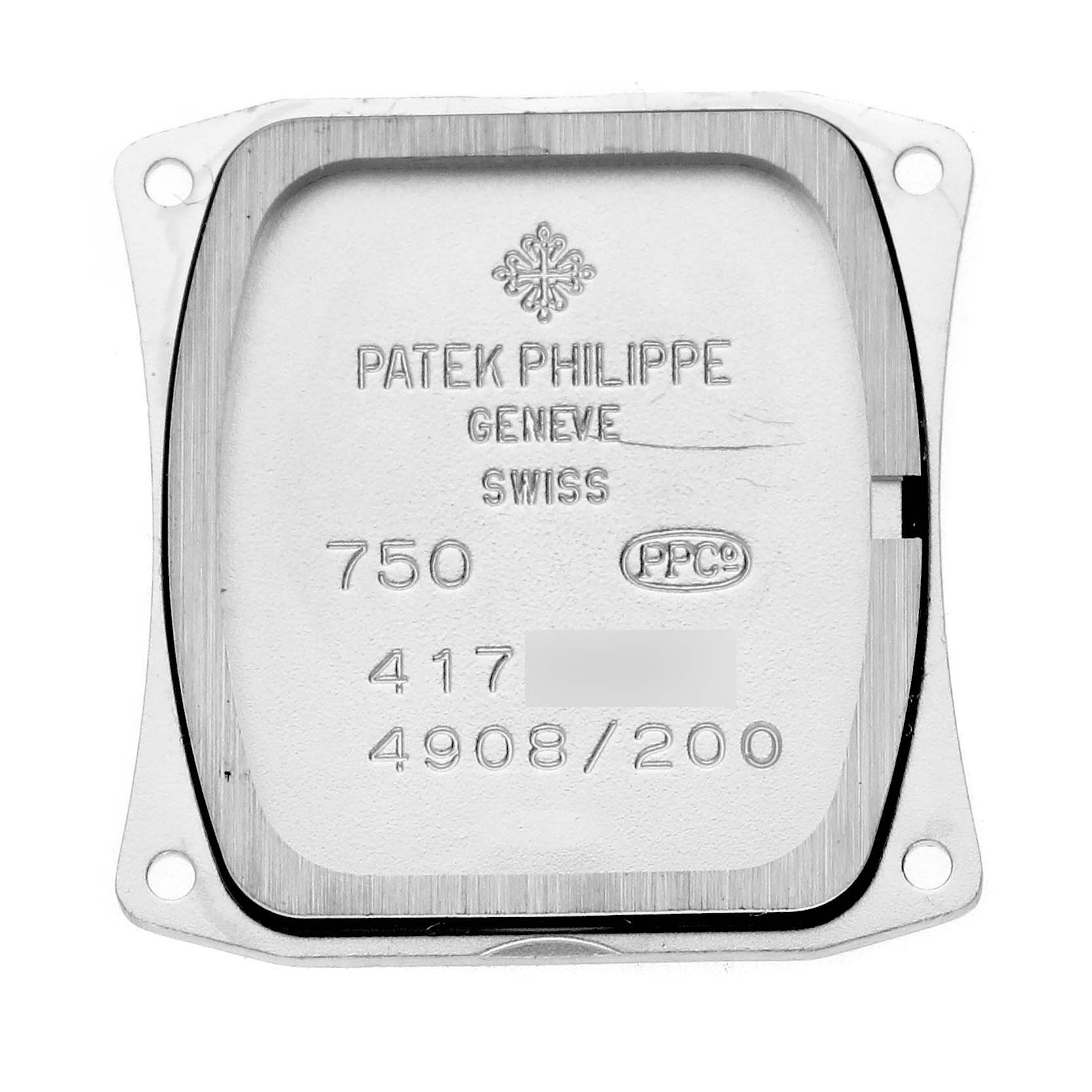 The image shows the interior case back of a Patek Philippe Twenty-4 4908/200G-011 Women's White Gold Silver Dial 4908/200G-011 Women's White Gold Silver Dial watch, displaying engravings and hallmarks.